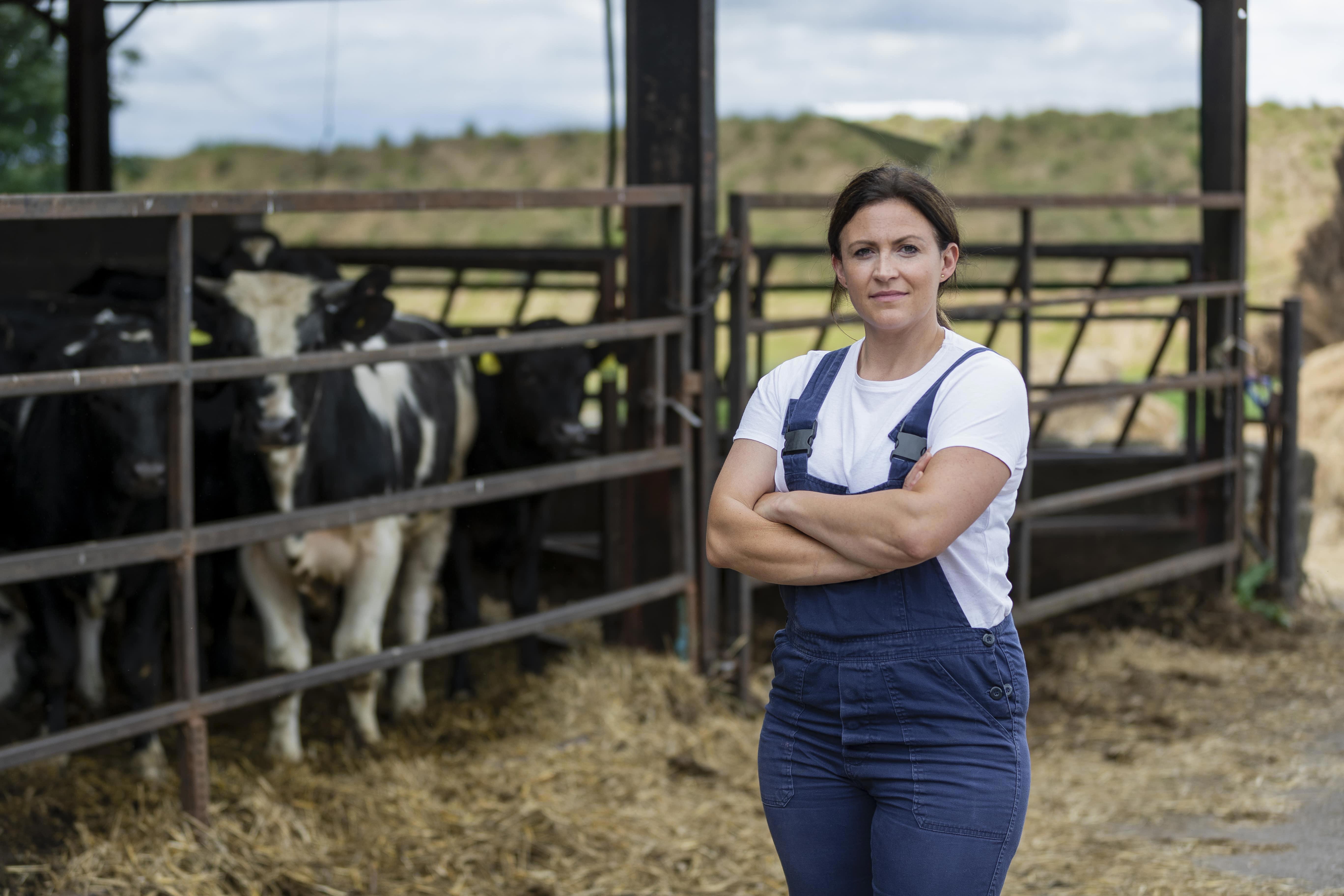 agro-dairy-farmer-outside-female-cow