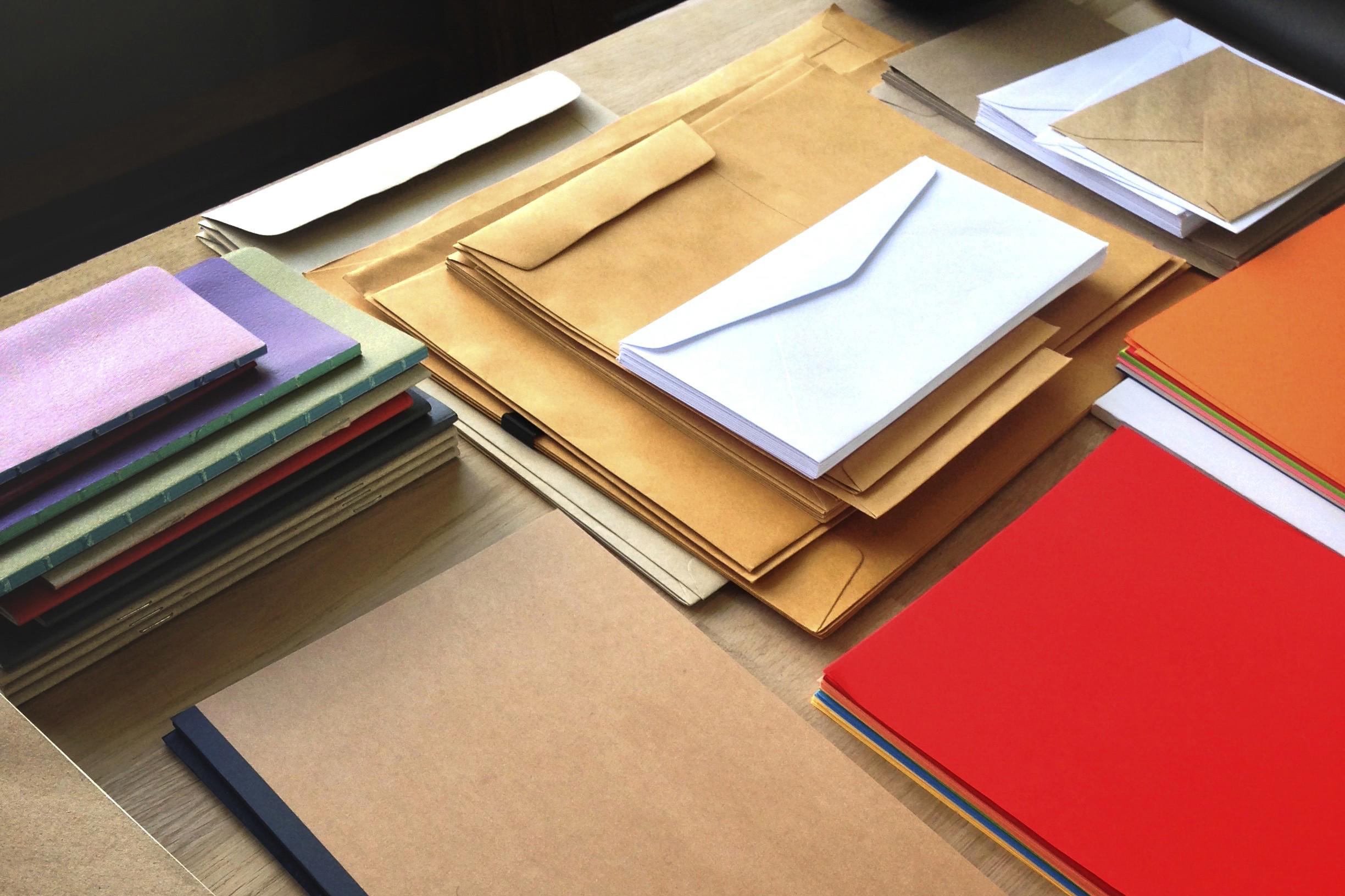 closeup-aerial-view-notepads-envelopes-letters-wooden-table (2)