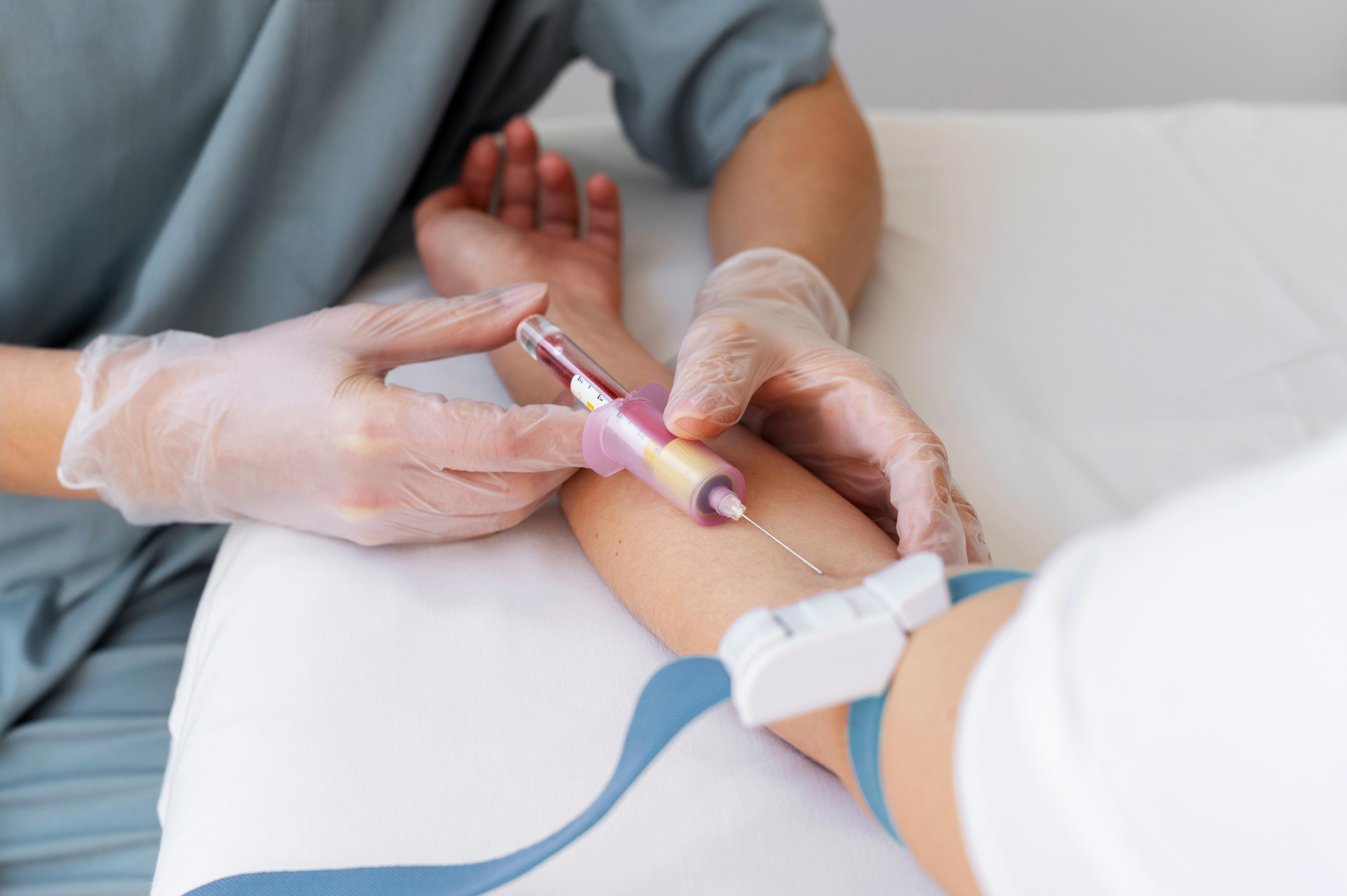 high-angle-healthcare-professional-drawing-blood