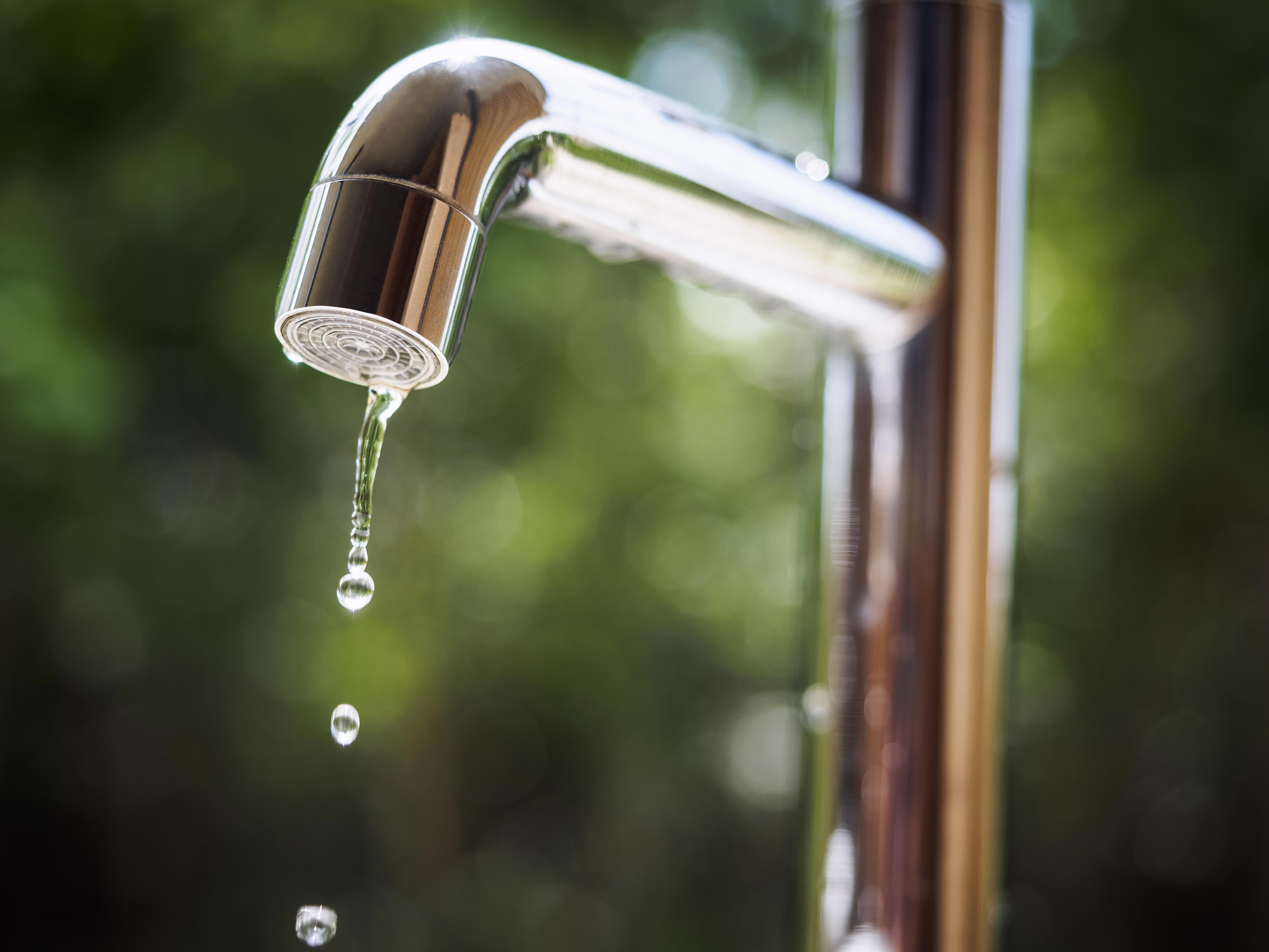 water-tap-with-water-drop-in-outdoor-green-park_6879-x-5160-px