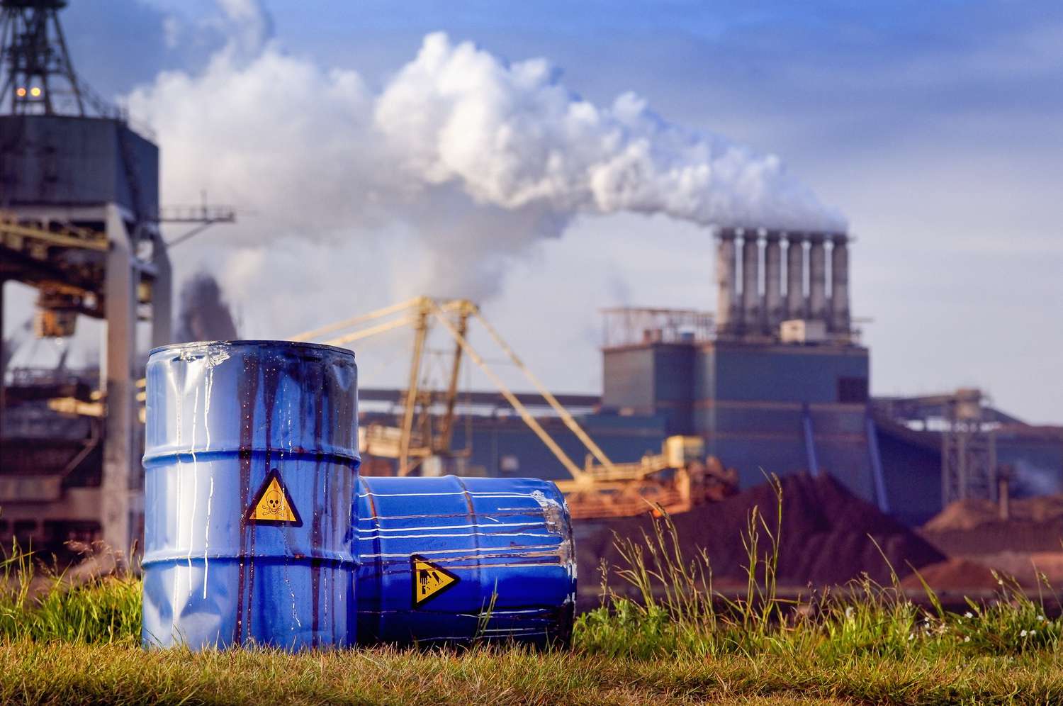 chemical-waste-drums-in-front-of-heavy-industry-466364914-24318d2ce2764da282f26e2a92ab4a5f