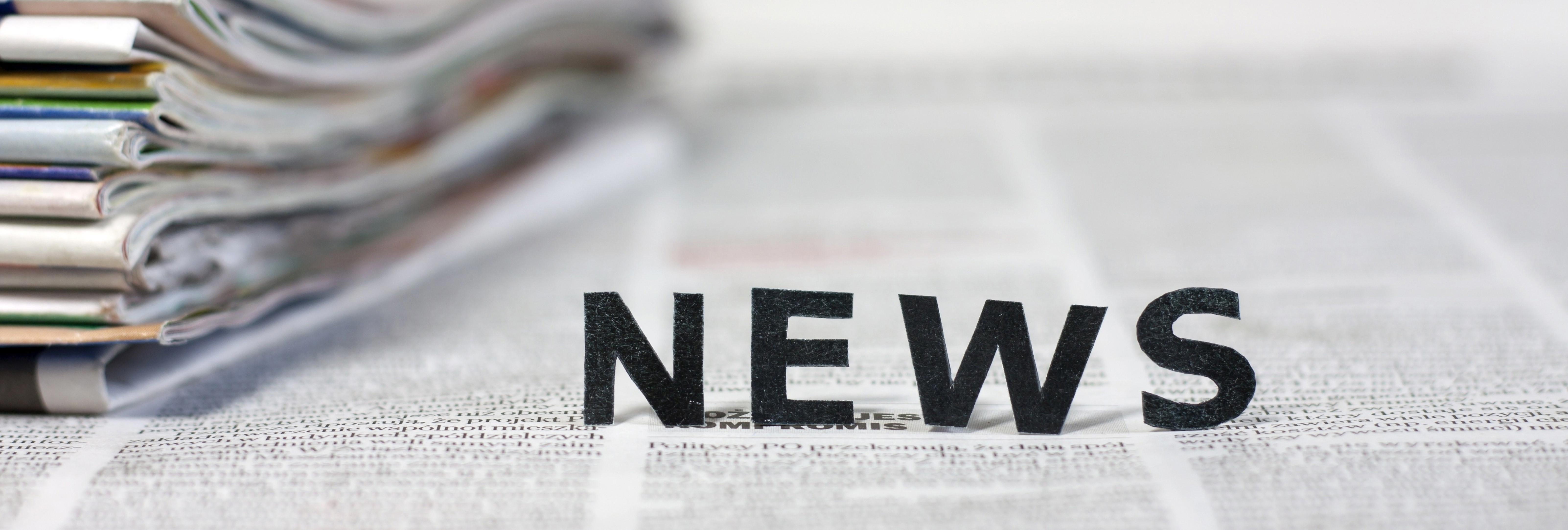 news-letters-on-newspapers-with-blurred-background-concept-xl