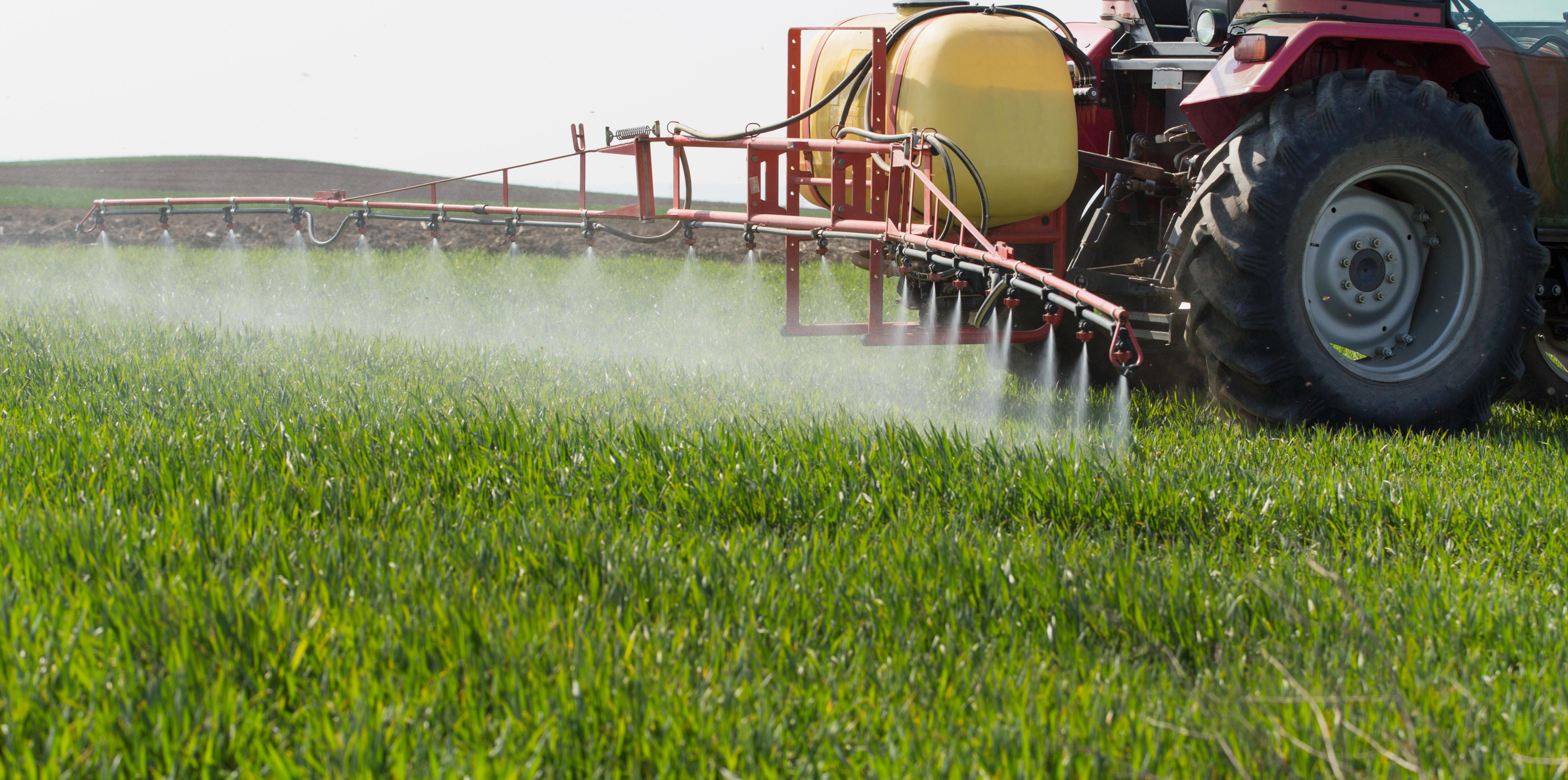 tractor-spraying-wheat-field-with-sprayer-herbicides-and-pesticides_7632-x-3798-px