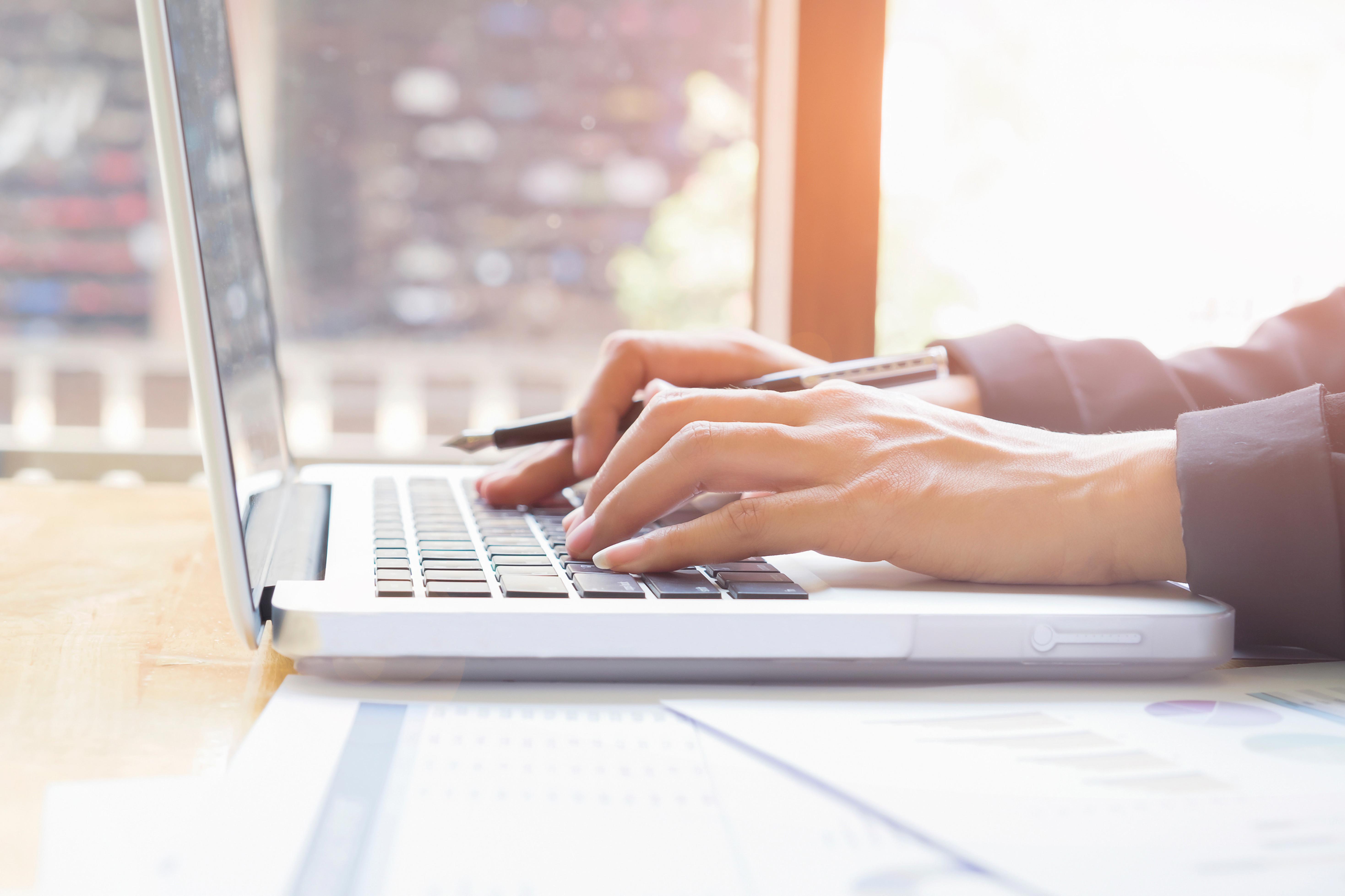 business-womans-hands-typing-on-laptop-keyboard_5875-x-3916-px