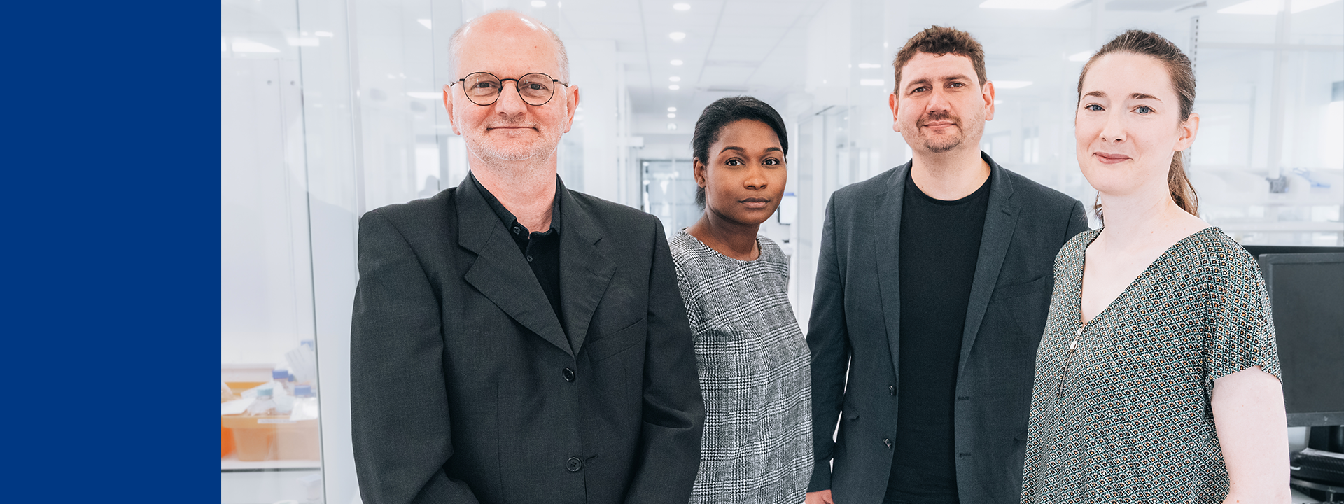  Four members of the MDS Consulting team in a bright, modern office setting, standing near desks and equipment, symbolising collaboration in clinical evaluation activities.