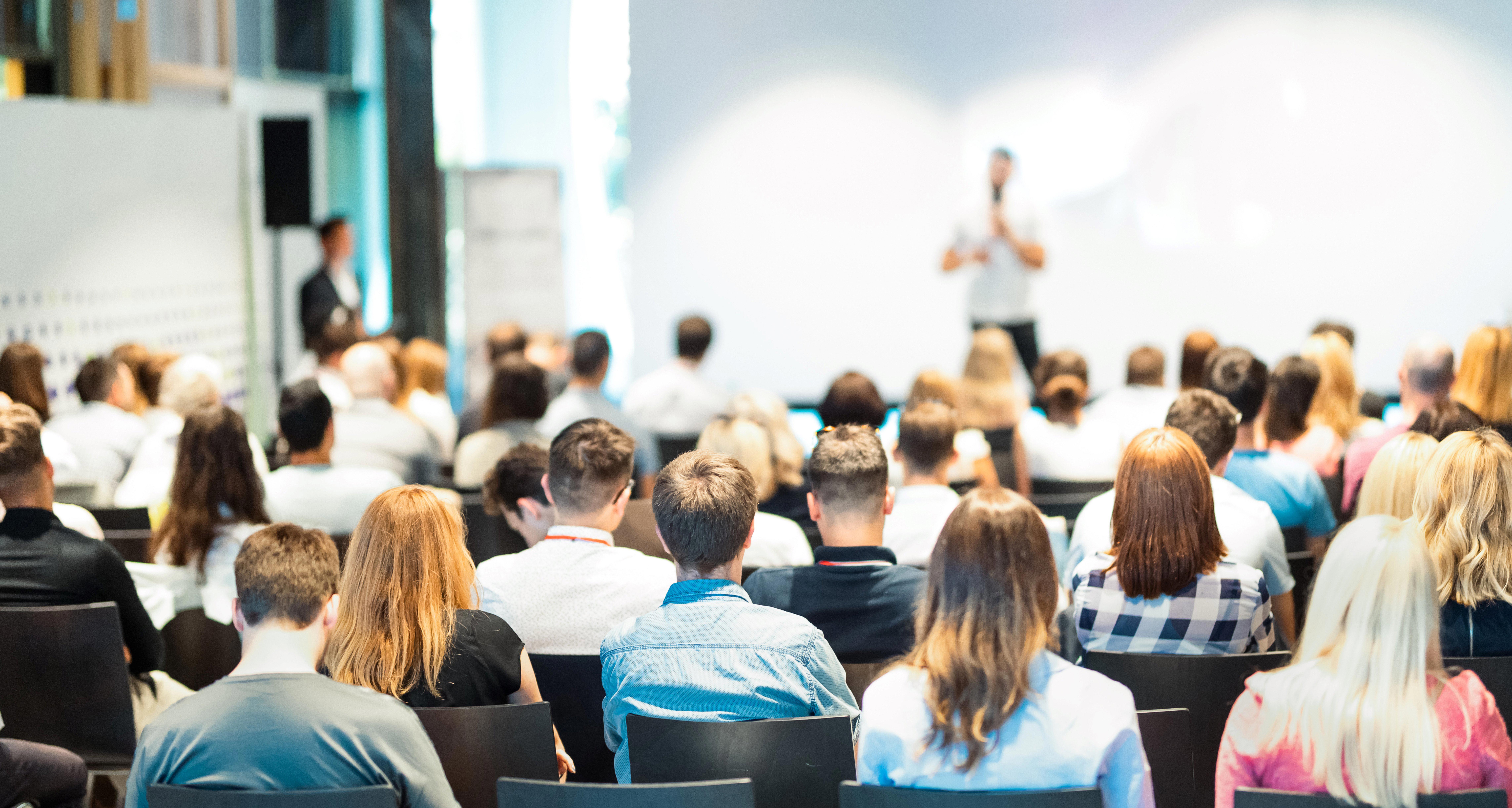 business-speaker-giving-a-talk-at-business-conference-event_9145-x-4884px-website