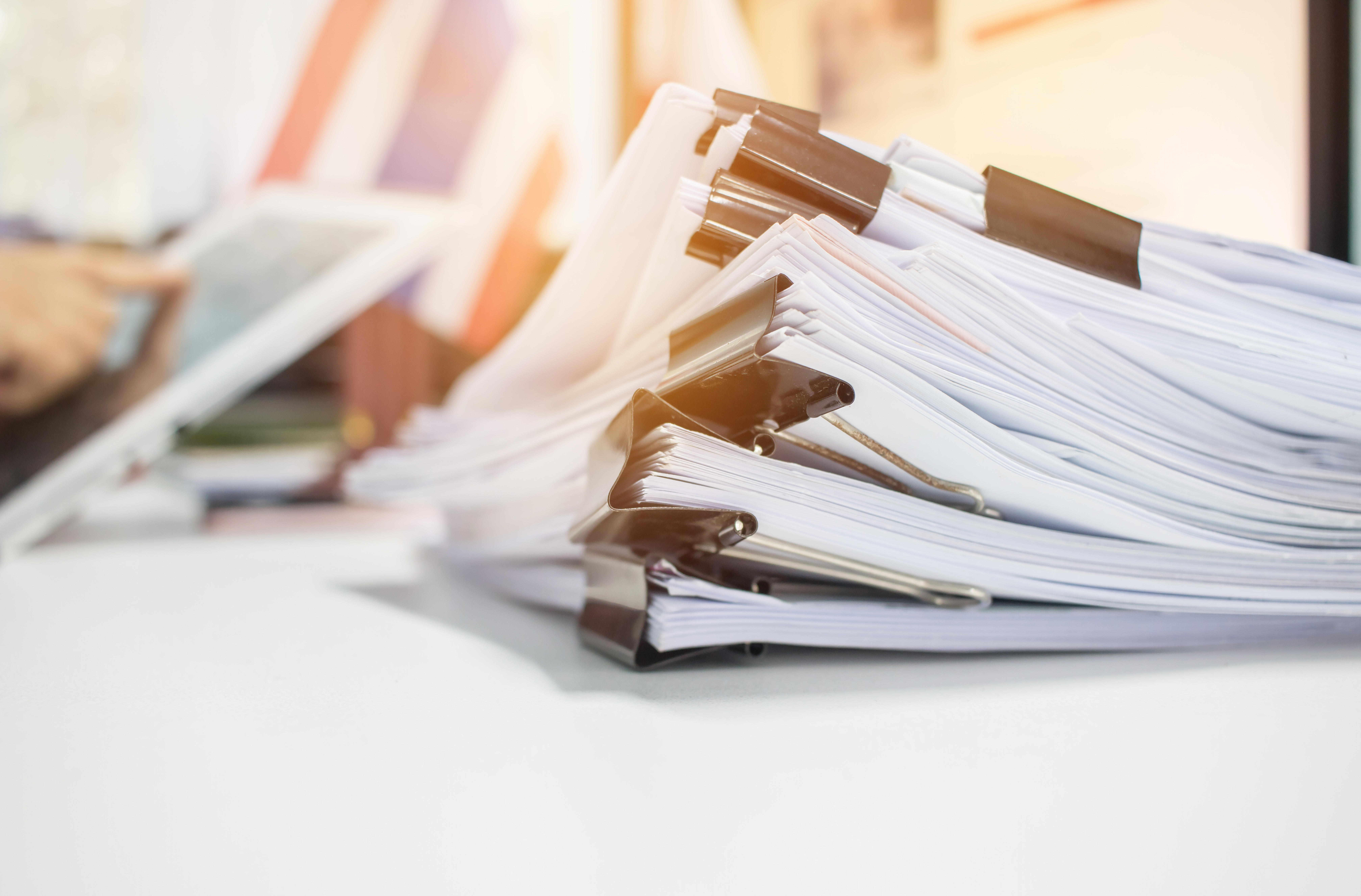 paper-stack-pile-of-unfinished-documents-on-office-desk-related-to-business-functions_8055-x-5304px