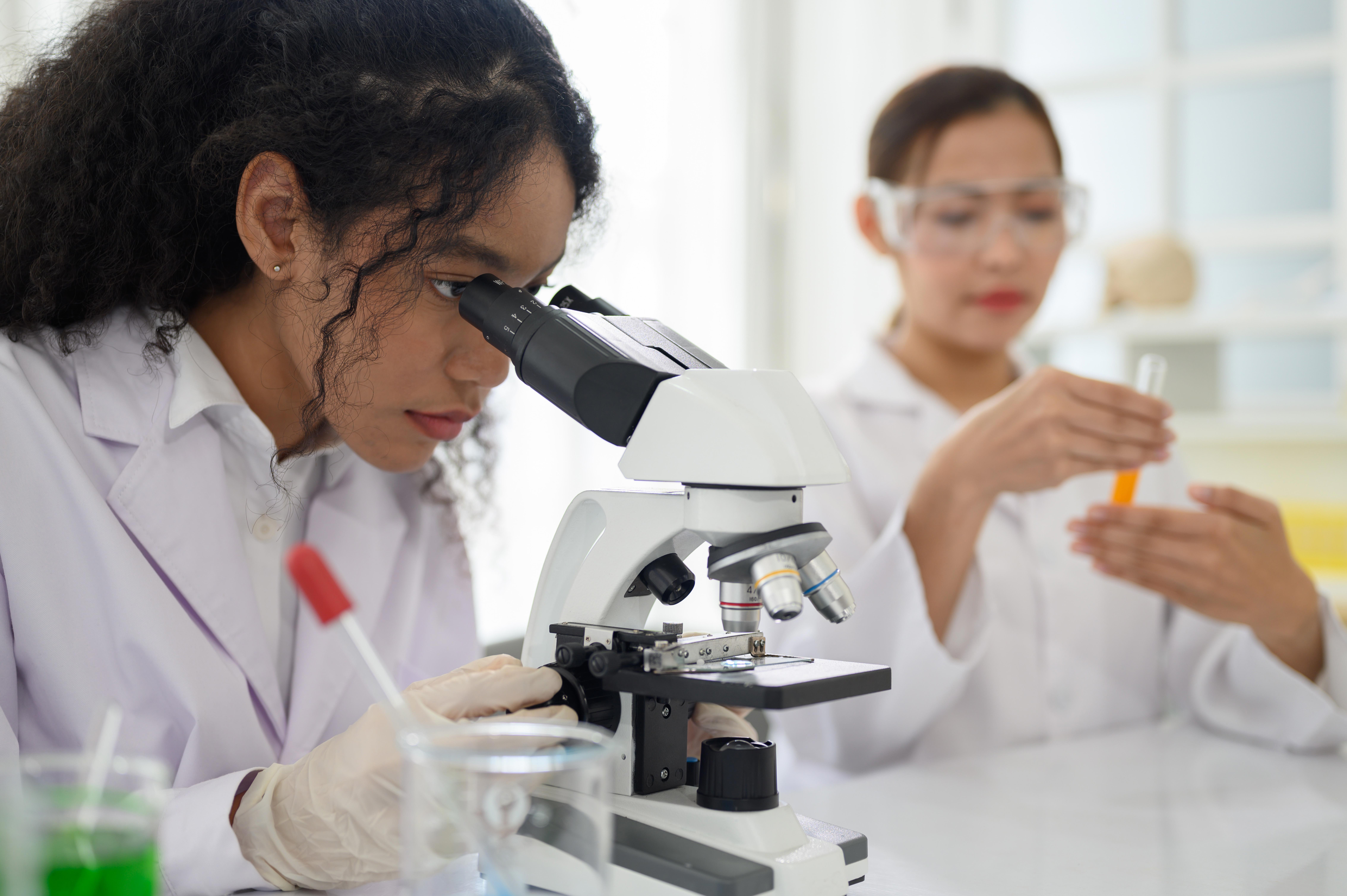 portrait-of-scientist-looking-under-microscope_9072-x-6036-px
