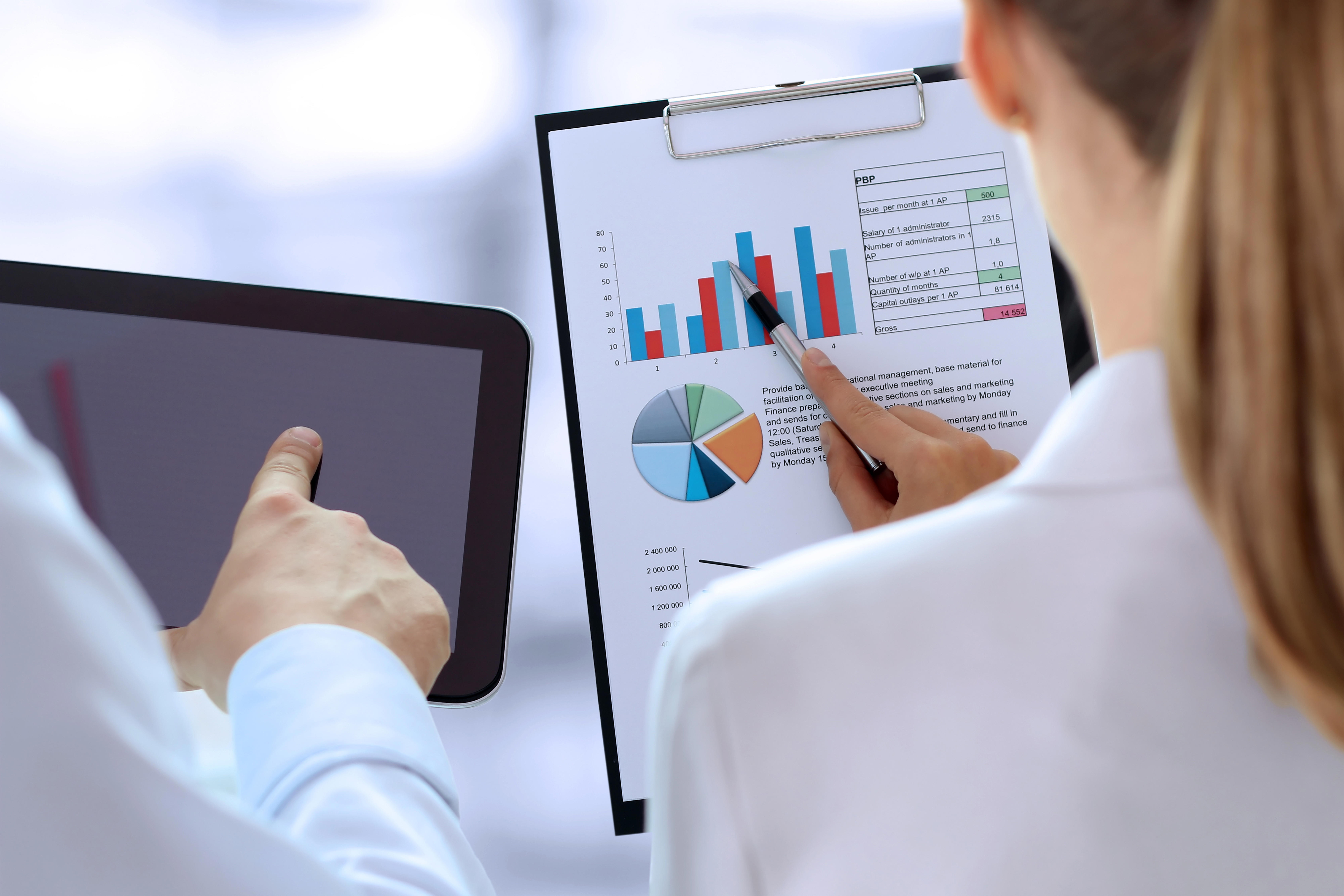 business-colleagues-working-and-analysing-financial-figures-on-a-graph_6750-x-4500-px