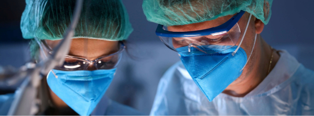 close-up-of-serious-professional-surgeons-in-blue-masks-at-operating-room_14305-x-7987px1 (1)
