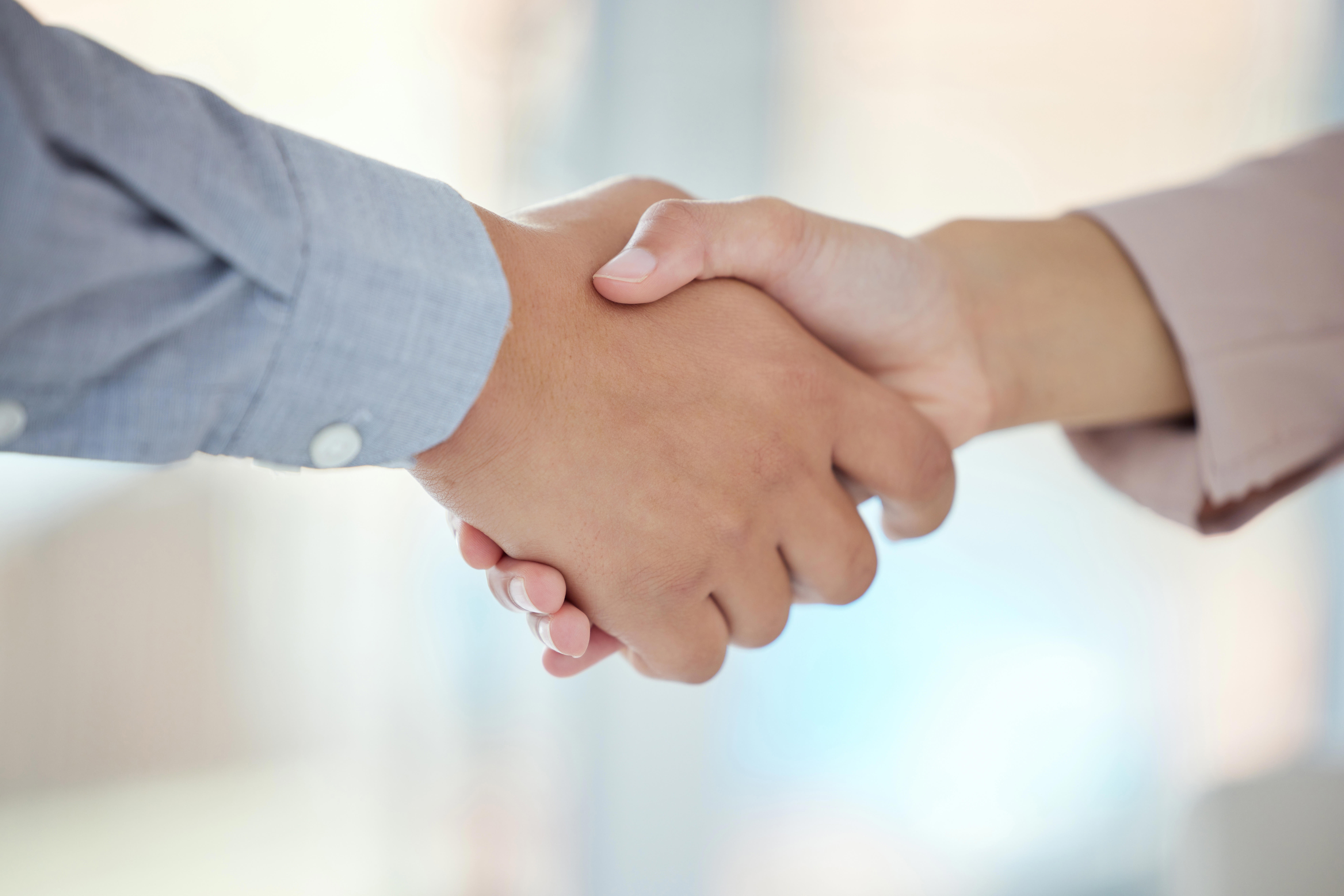 closeup-shot-of-two-unrecognisable-businesspeople-shaking-hands-in-an-office_11901-x-7938px