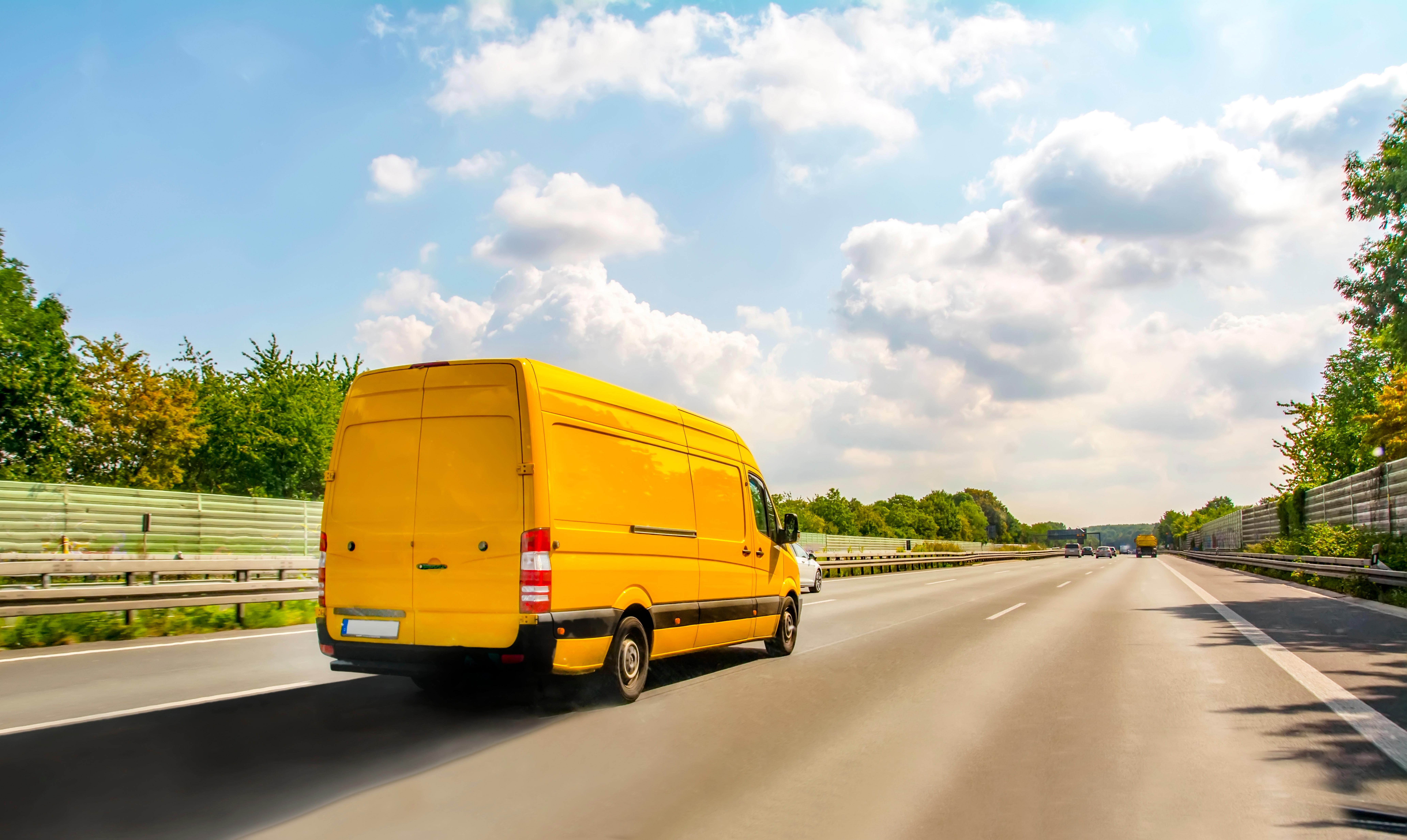 yellow-van-on-the-highway-in-germany-freight-transport-concept_8260-x-4933-px