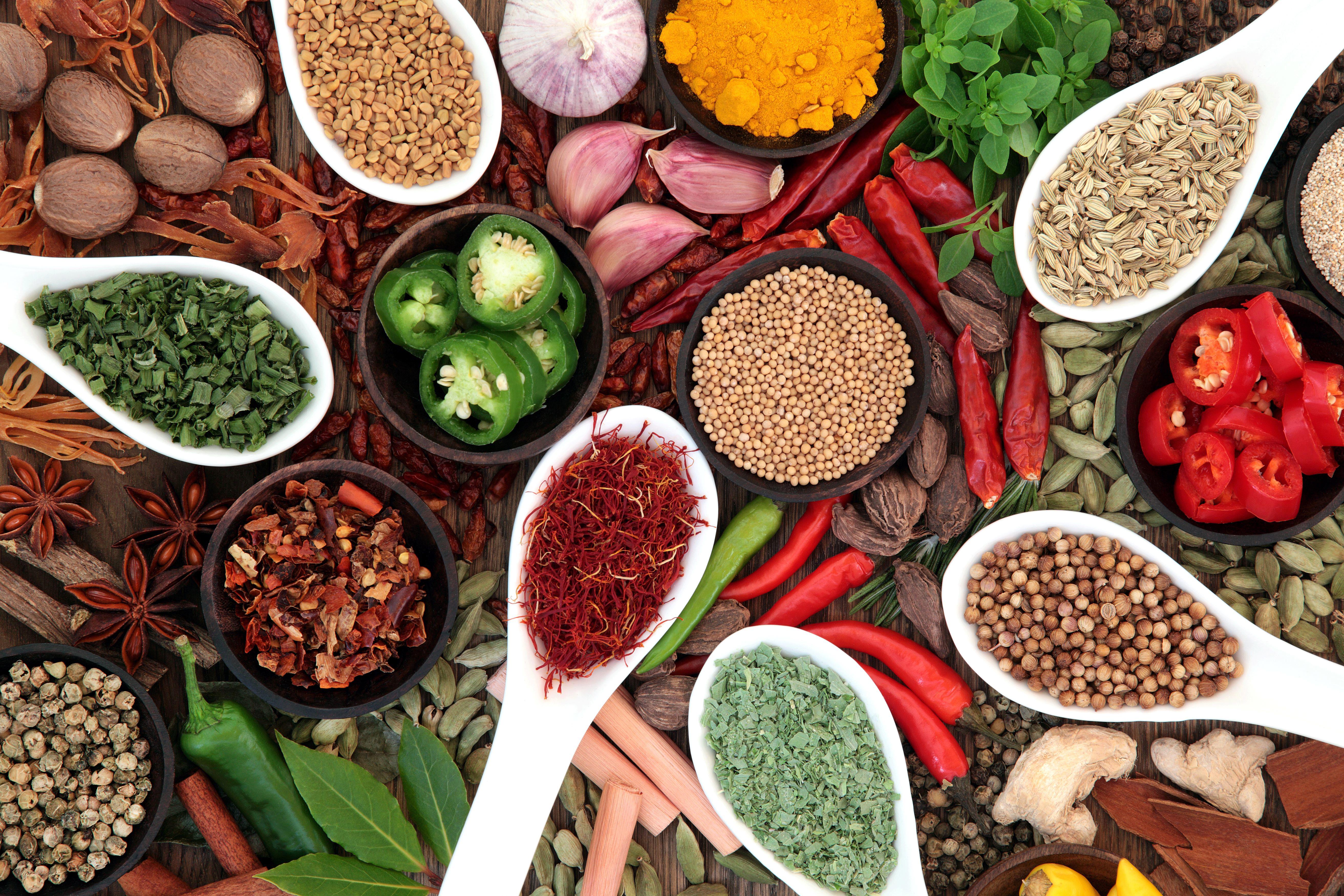large-spice-and-herb-collection-in-bowls-and-spoons-forming-an-abstract-background-xxl_5250x3500px