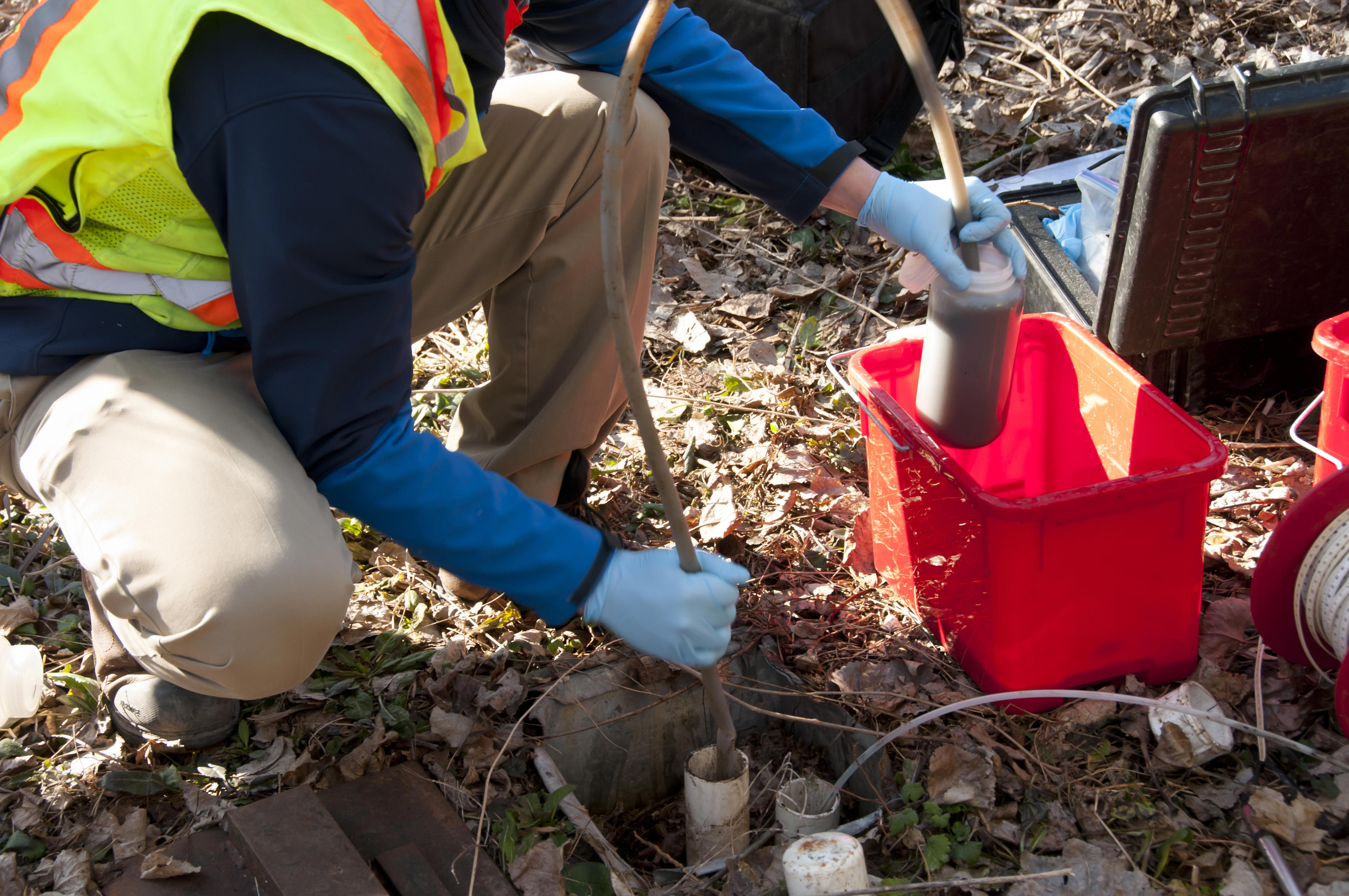male-with-hose-extracting-wastewater