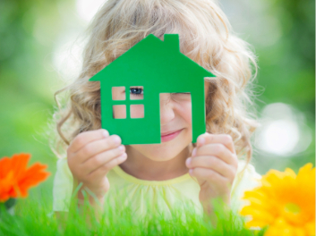 happy-child-holding-house-in-hands-against-spring-green-background-real-estate-business-concept-xl_8640x5760px1