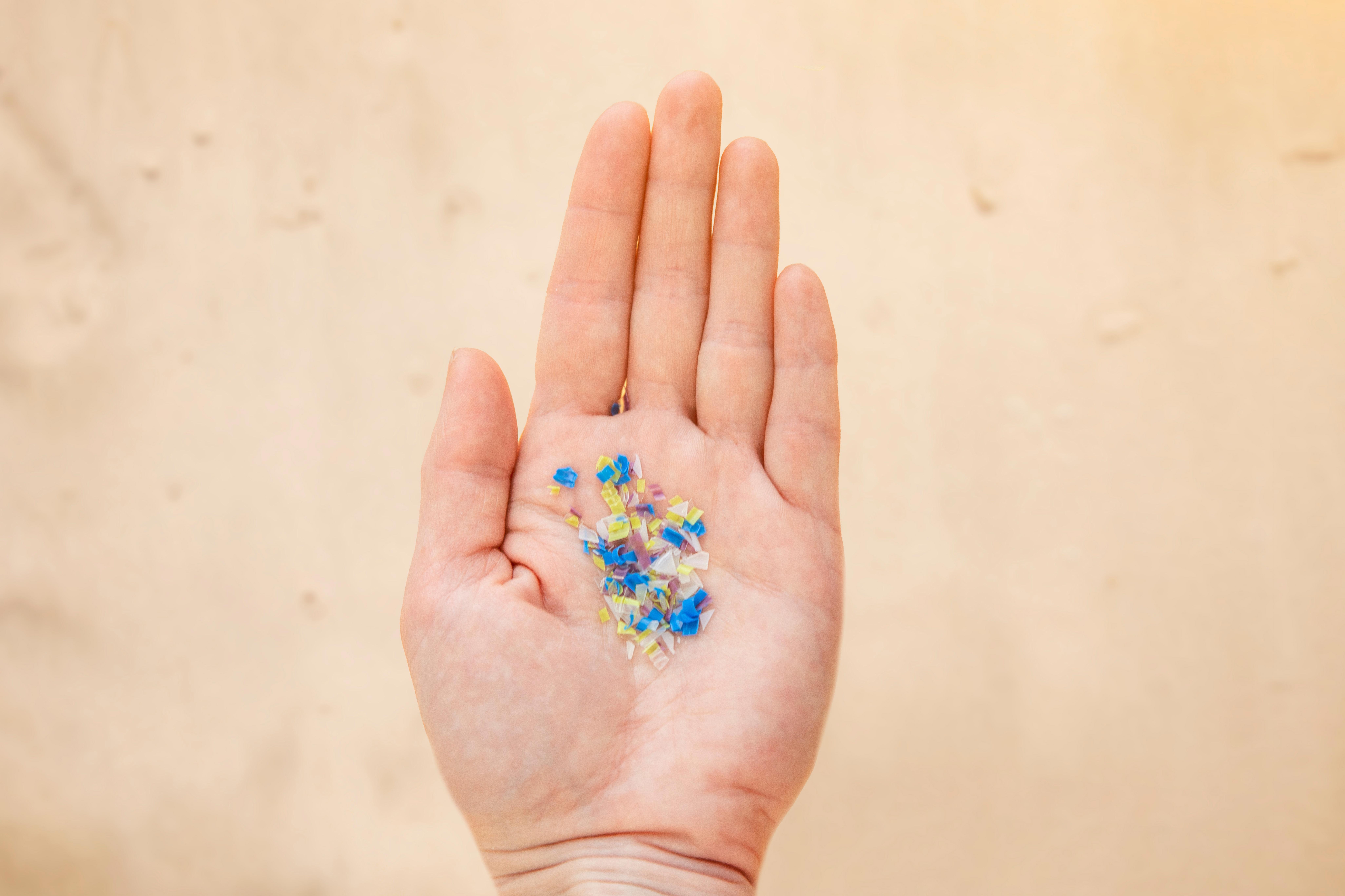 microplastic-in-the-hand-of-a-man-on-the-beach-environmental-pollution-and-water-micro-plastic_-8208-x-5472-px