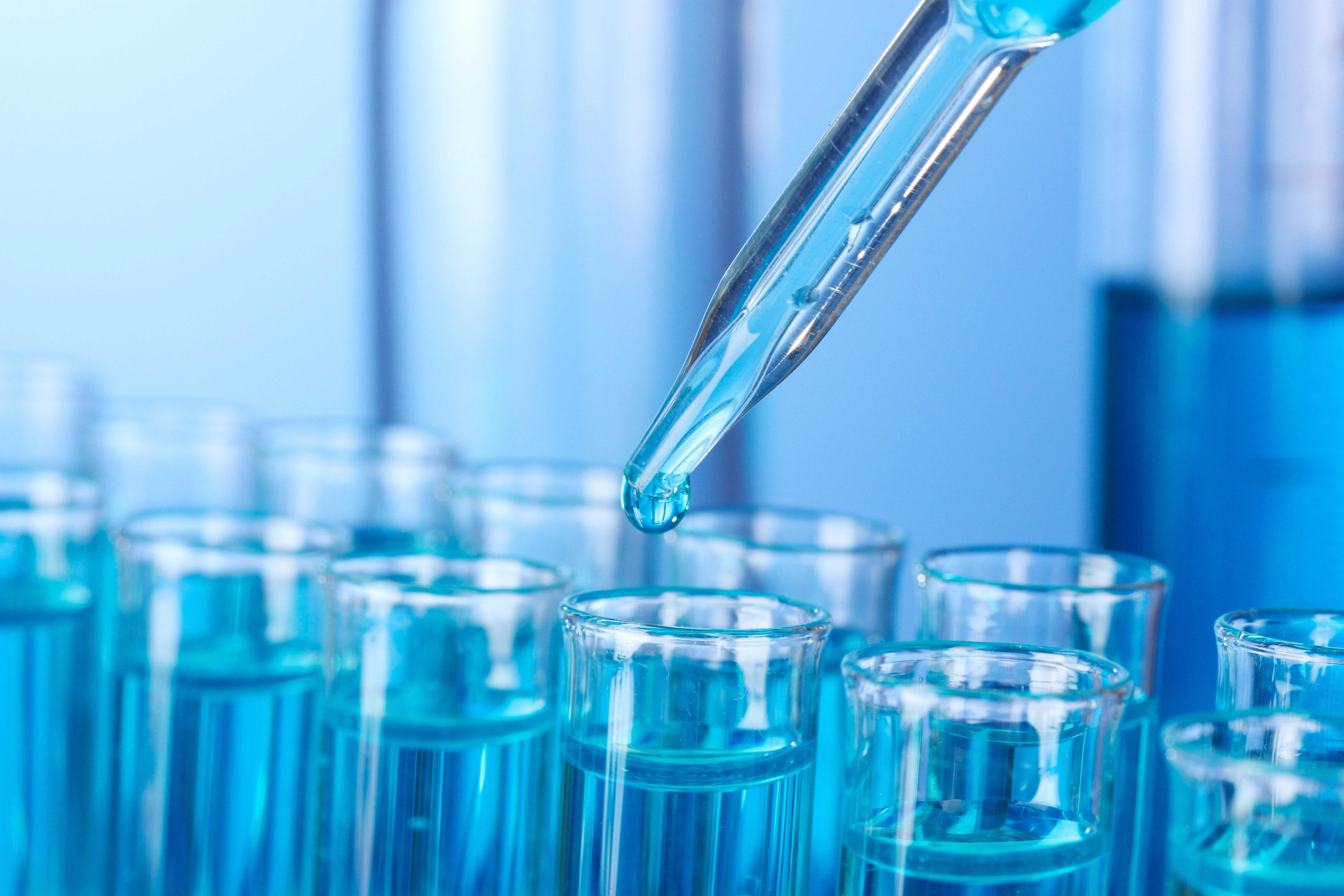 test-tubes-on-blue-background_7776-x-5184-px