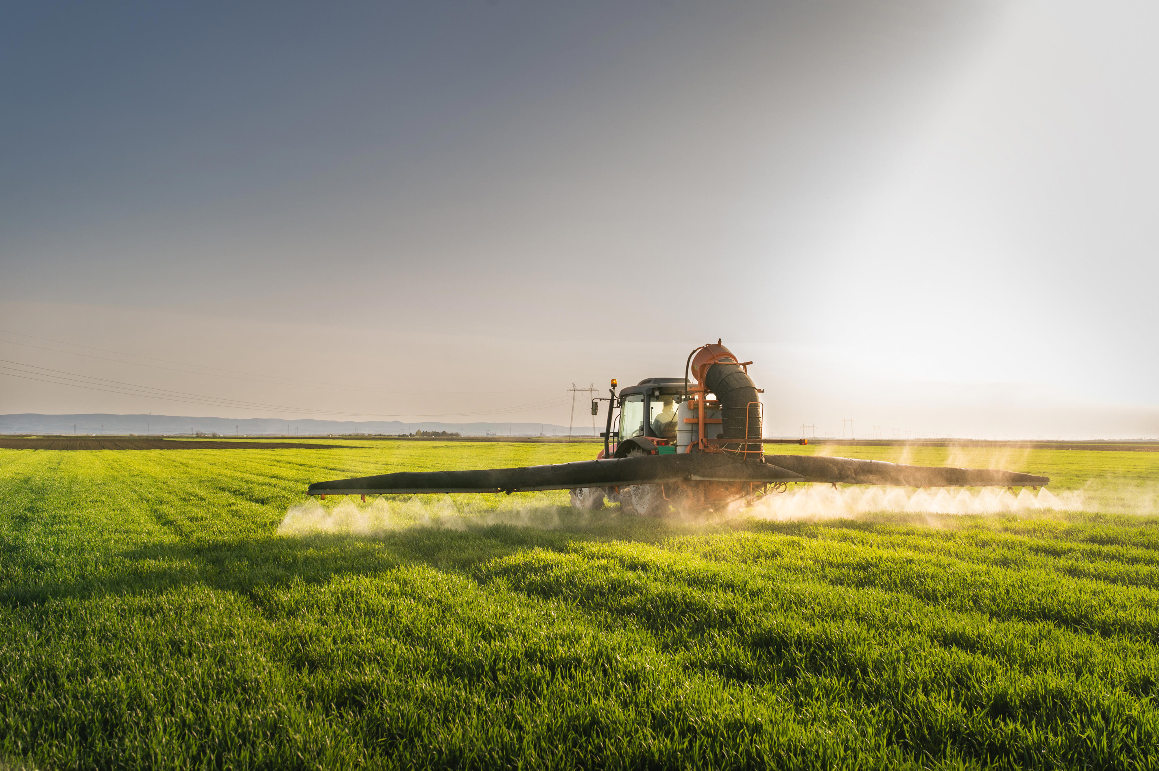 tractor-spraying-wheat-field-with-sprayer_4507-x-3000px