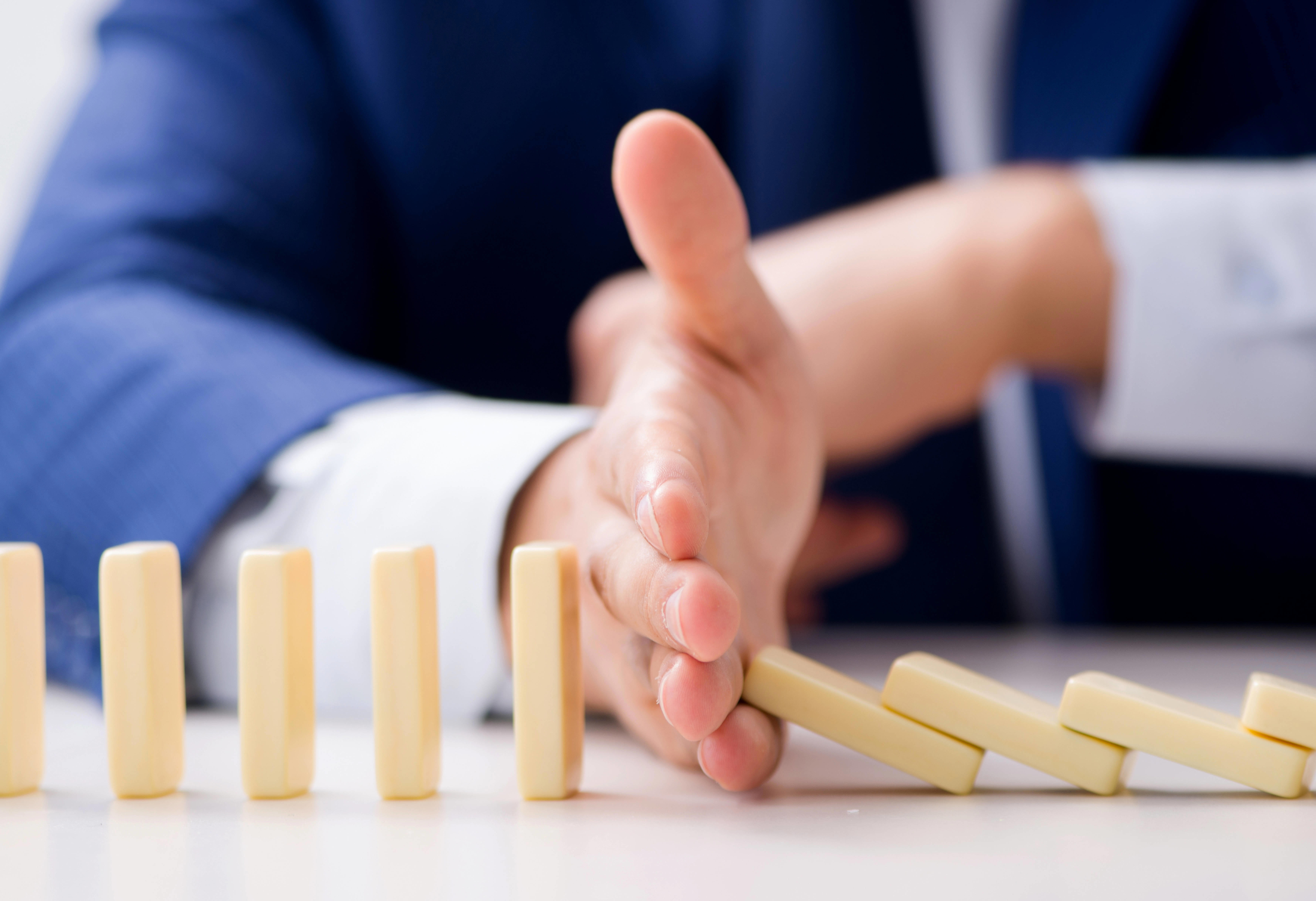 businessman-playing-with-domino
