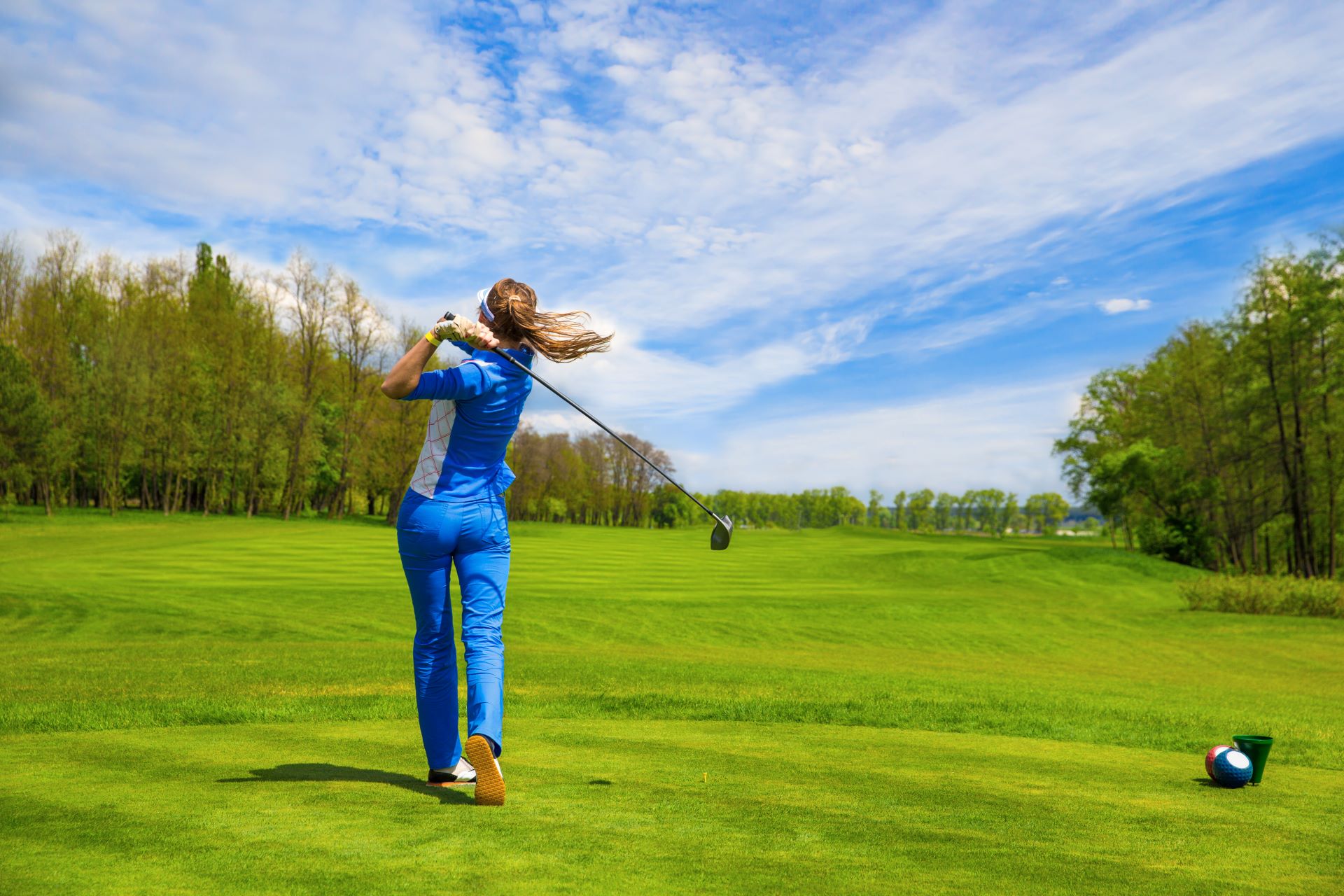 woman-golf-player-hitting-by-iron-from-fairway_8640-x-5760-px_2