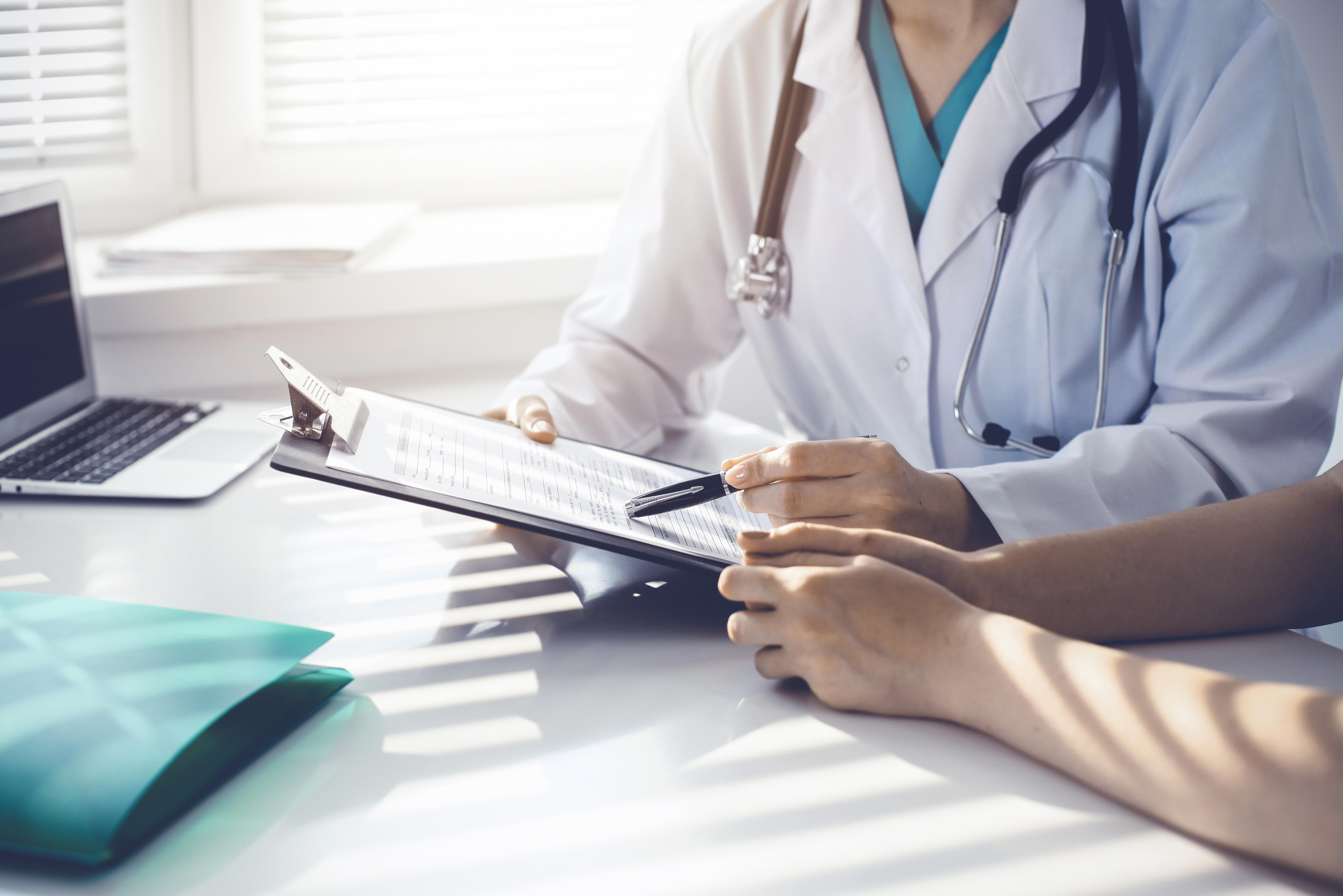 doctor-and-patient-are-discussing-something-in-clinic_5605-x-3738px