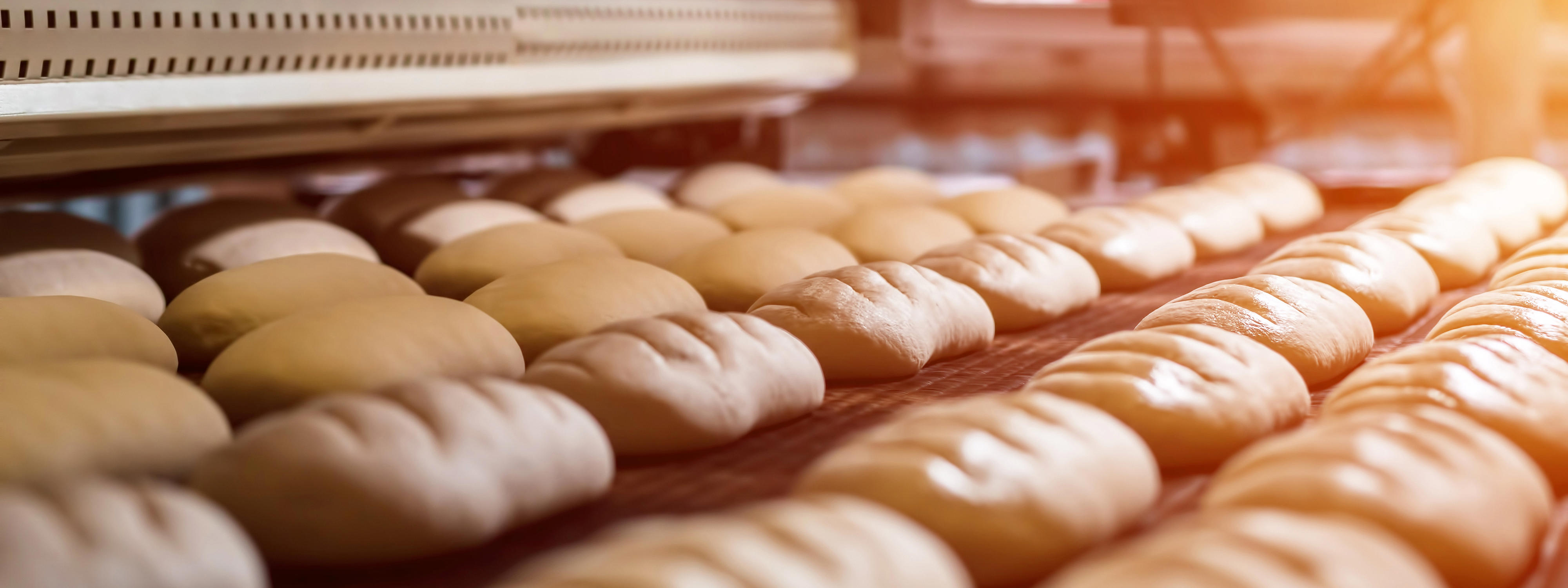 dessert-bread-baking-in-oven-production-oven-at-the-bakery-baking-bread-manufacture-of-bread_1920x720-px
