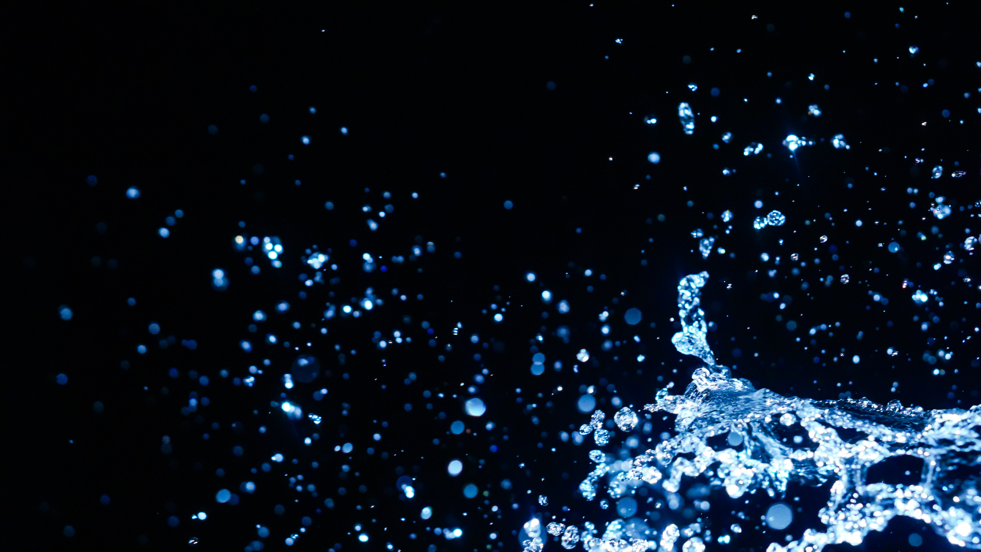 abstract-blue-water-splash-against-black-backgroun-2026-04-14-03-45-22-utc