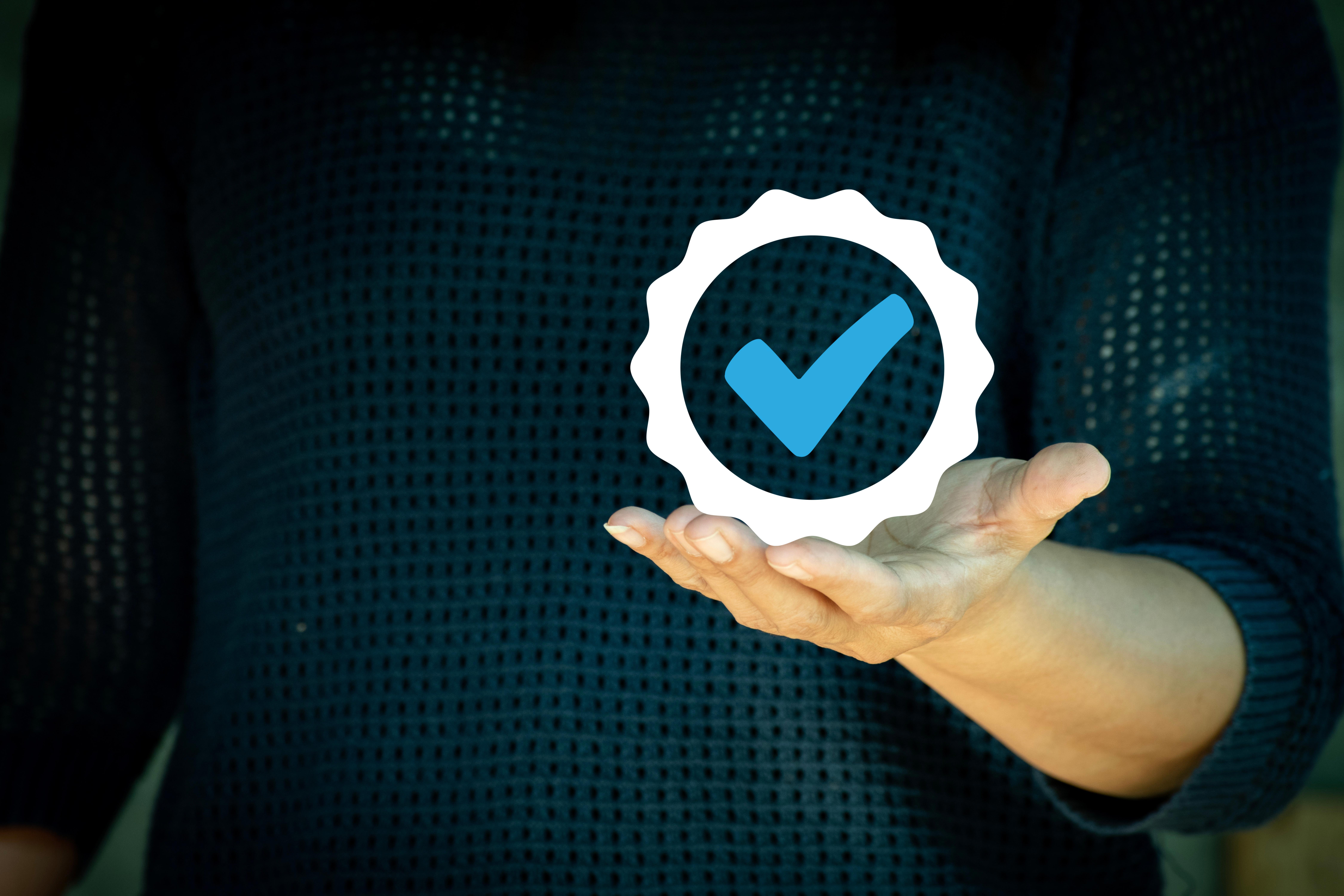 hand-shows-the-sign-of-the-top-service-quality-assurance_9000-x-6000-px