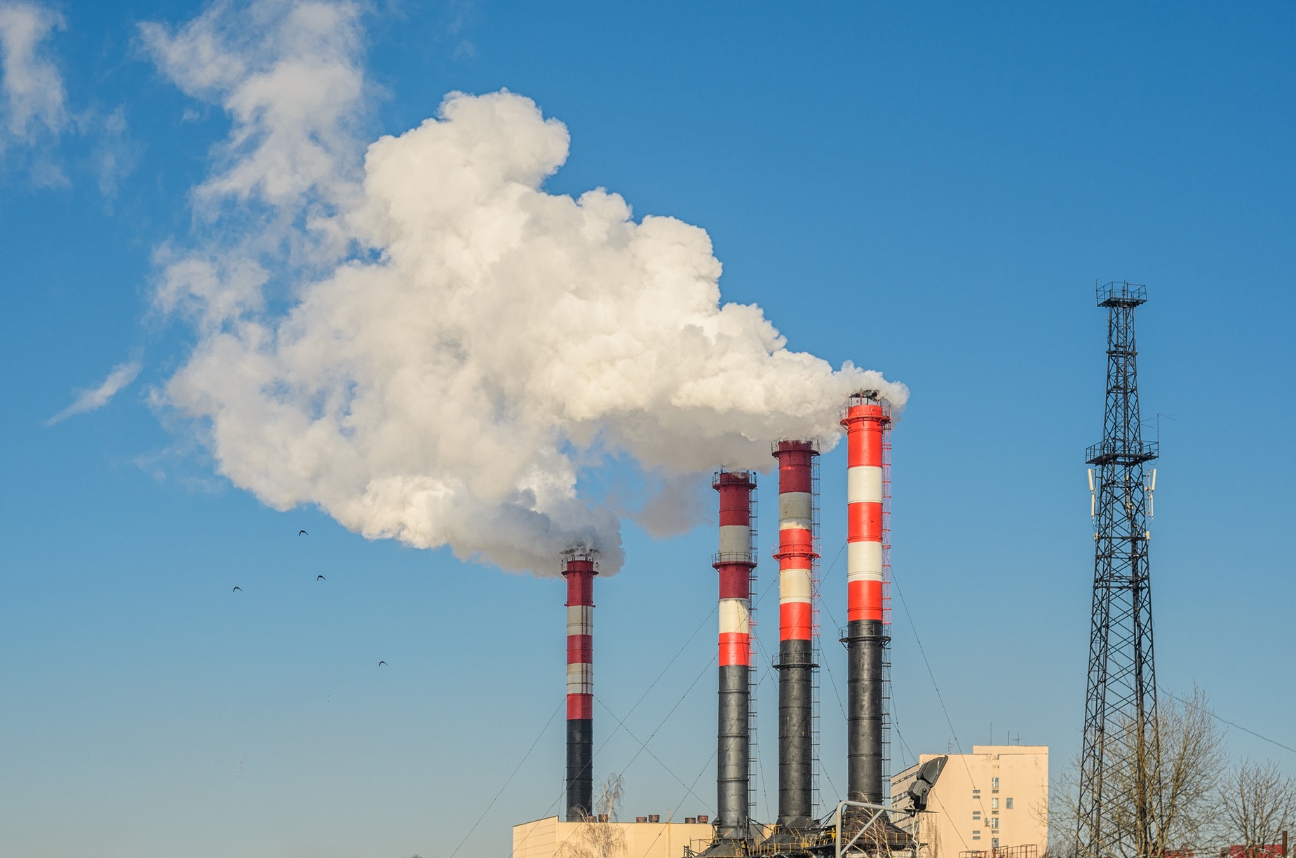 plant-pipes-with-smoke-against-clear-blue-sky_7392-x-4896px