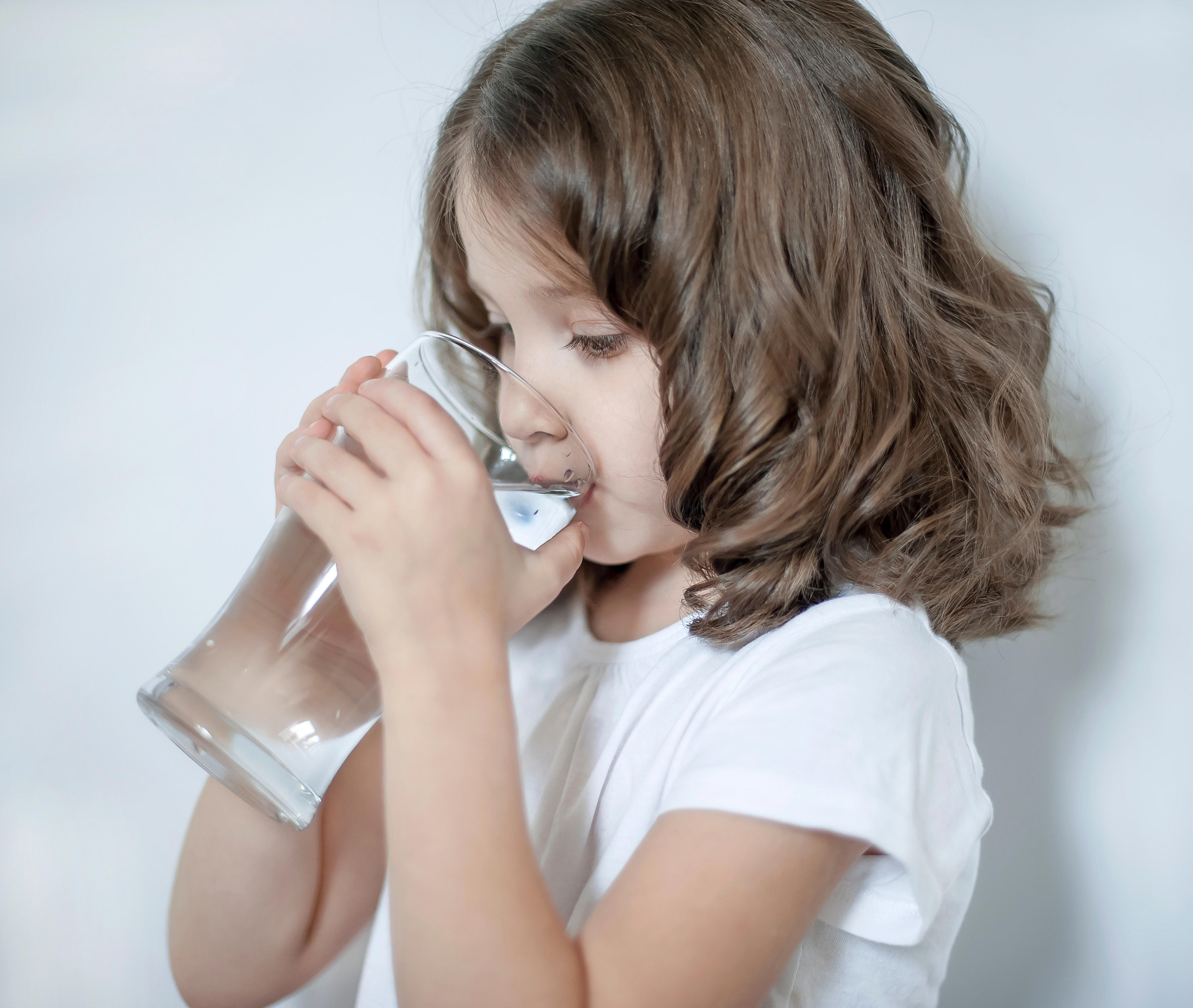 child-drinking-clean-water-at-home-close-up_4437-x-3750-px