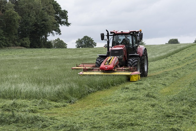 agro-tractor-red-mowing-gras-hill