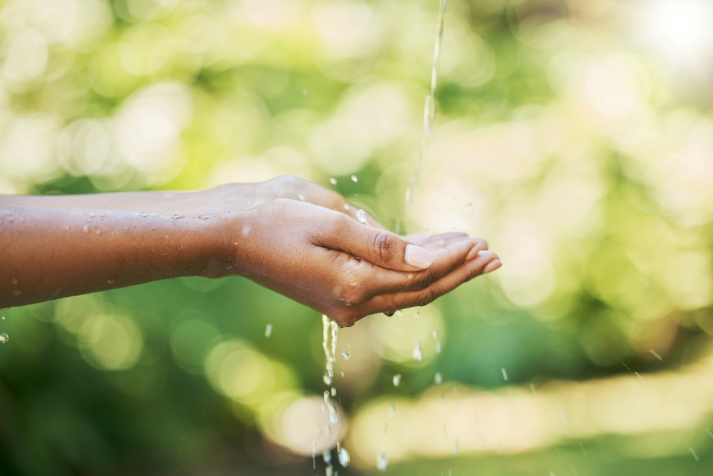 person-holiding-out-their-hands-to-collect-water-from-a-tap-outdoors_11901x7938px