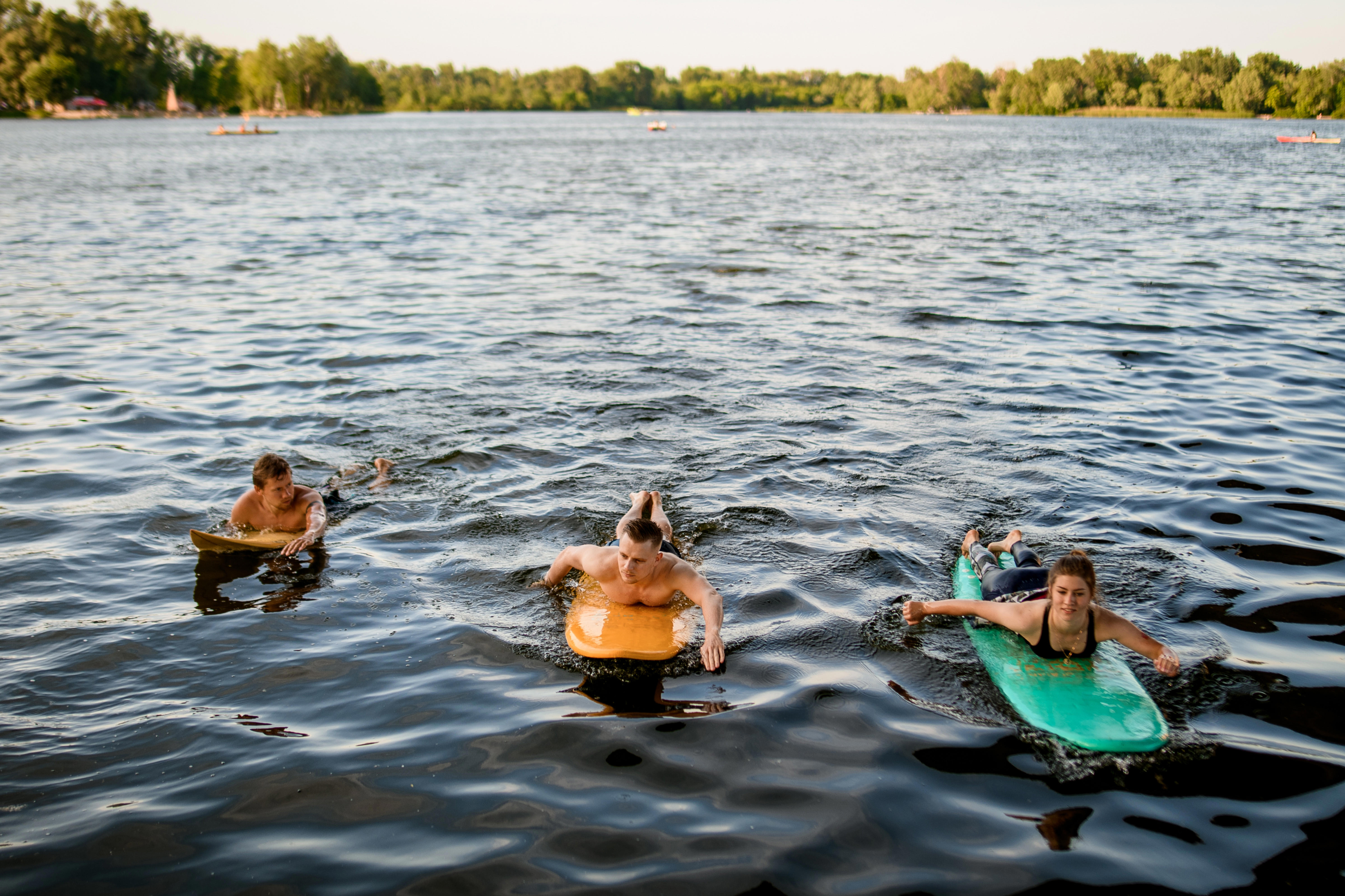 front-view-of-group-of-people-which-floating-on-surf-boards-on-river-water_5959-x-3969px