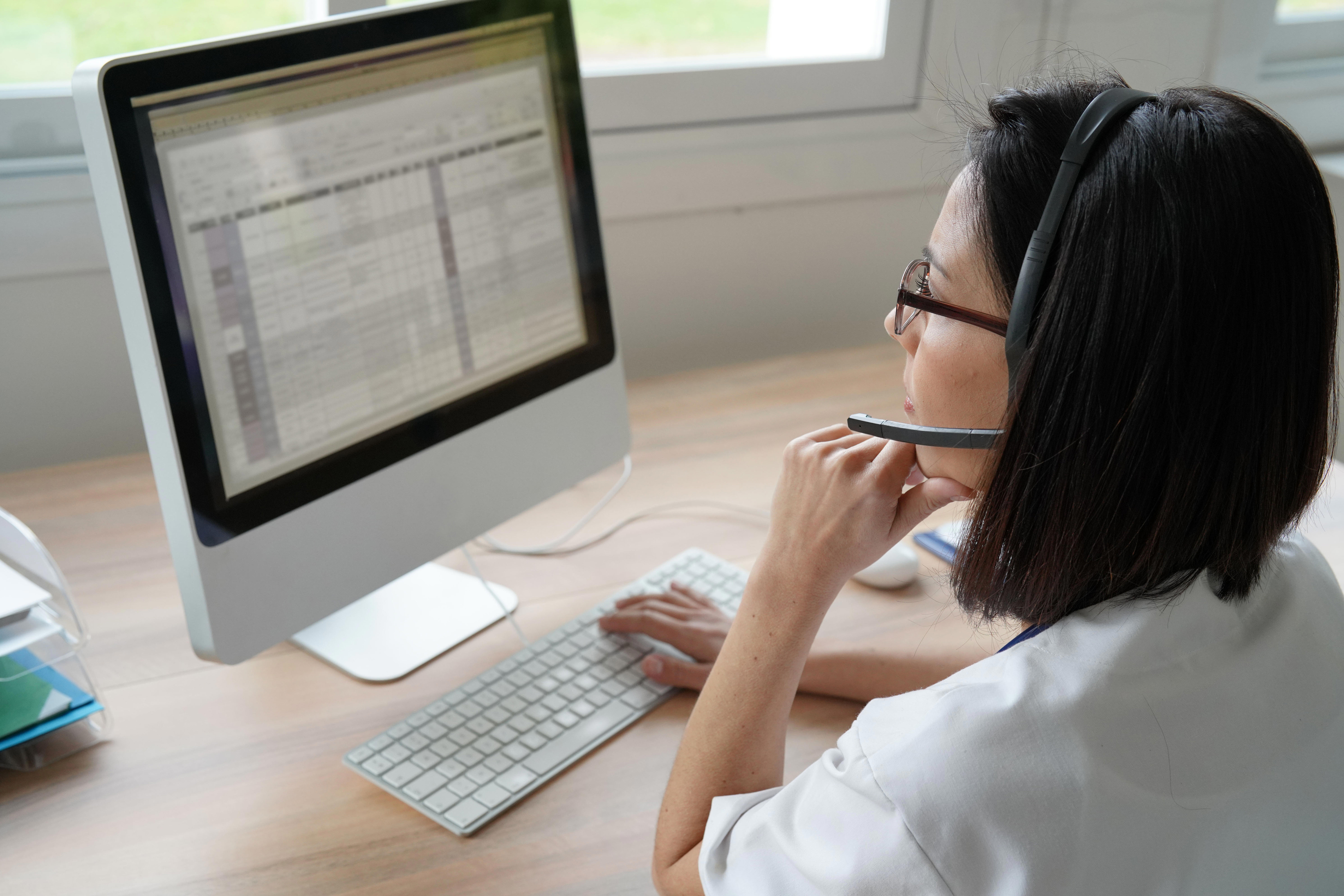medical-secretary-typing-report-on-deskop-computer_8946-x-5967-px