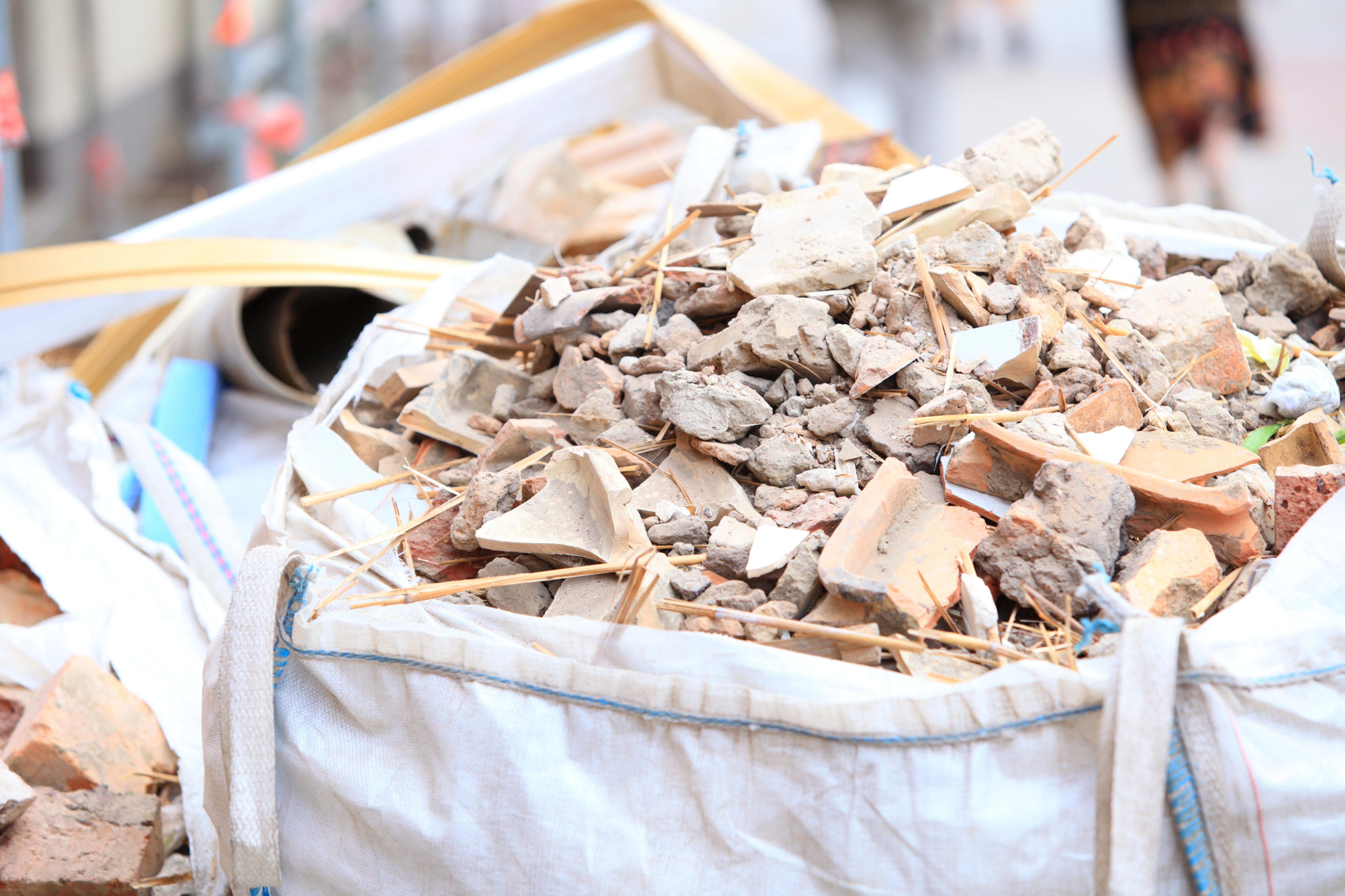 full-construction-waste-debris-bags-garbage-bricks-and-material-from-demolished-house_8328-x-5551-px
