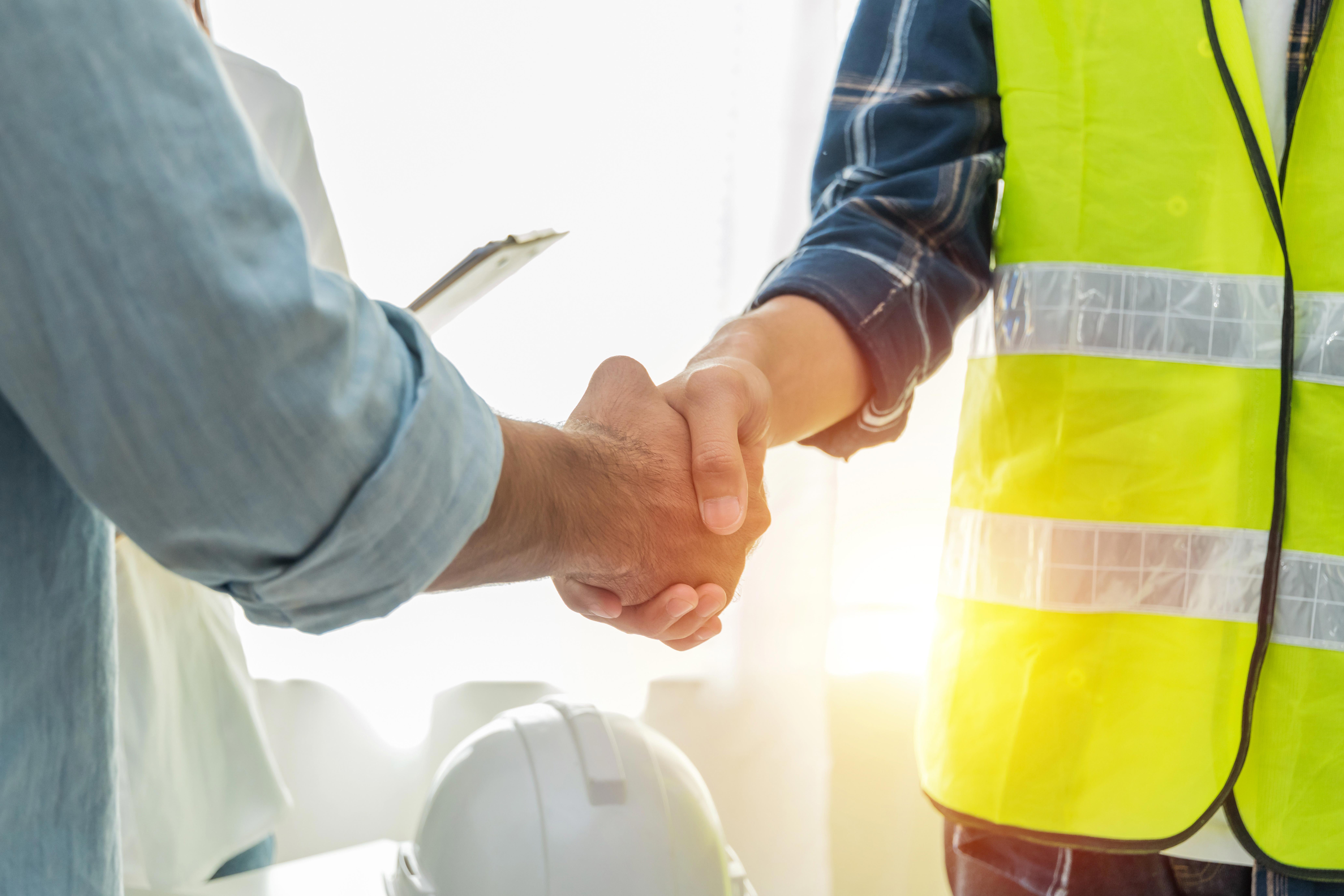 contractor-construction-worker-team-hands-shaking-after-plan-project-contract_-8250-x-5500-px