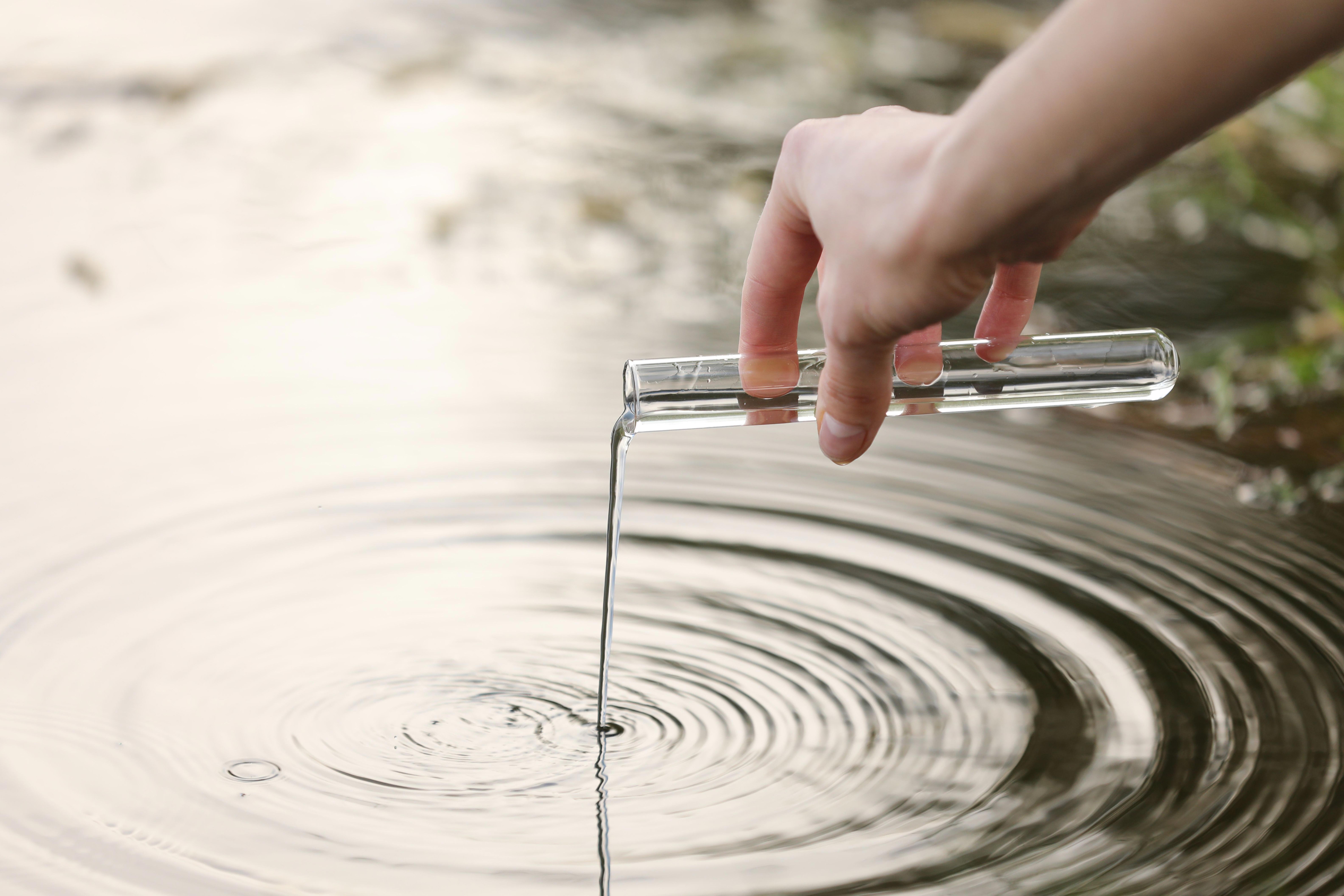close-up-shot-of-scientist-biologist-and-researcher-in-protective-suit-taking-water-samples_9504-x-6336px