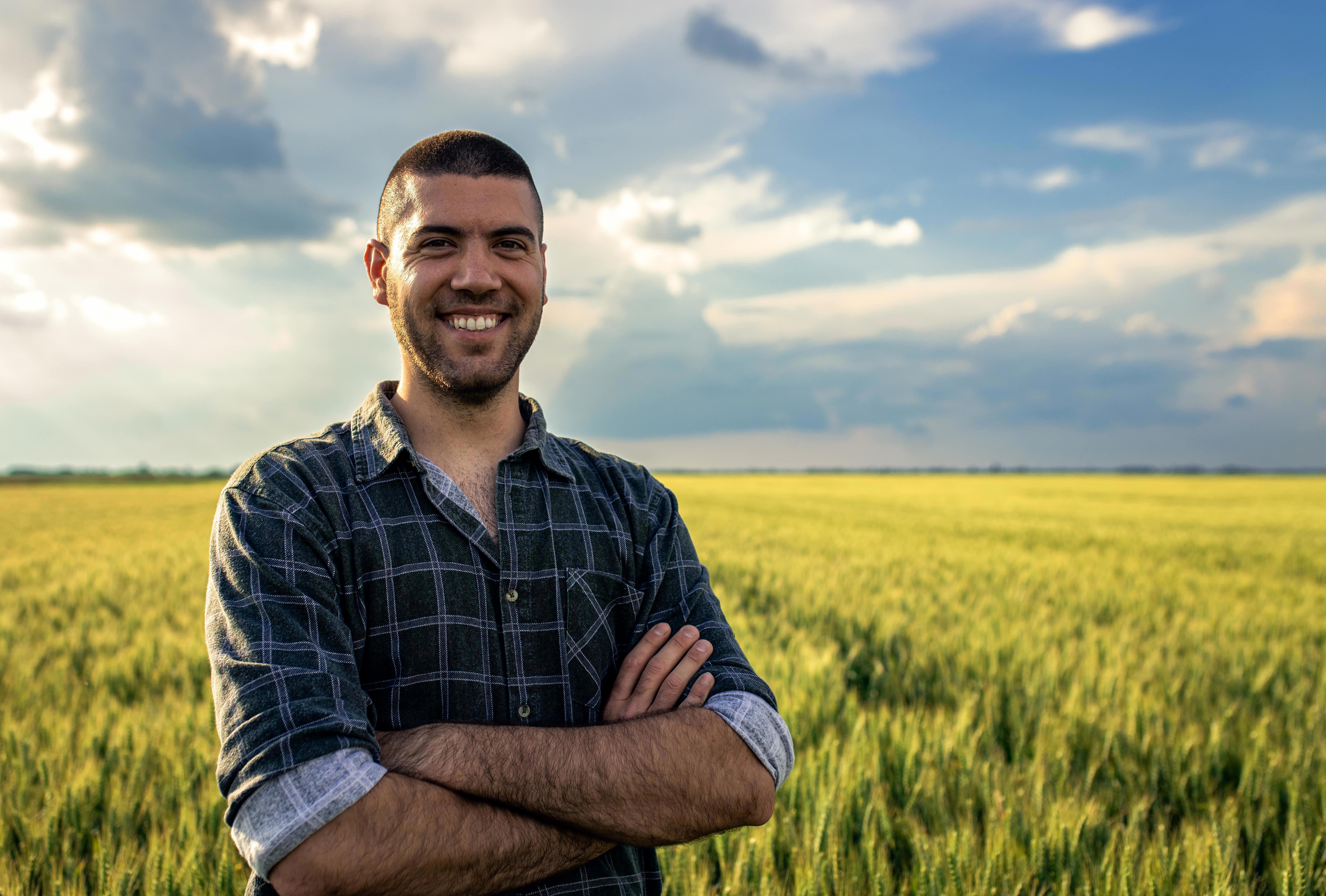 agro-farmer-in-young-wheat-field-6276x4242