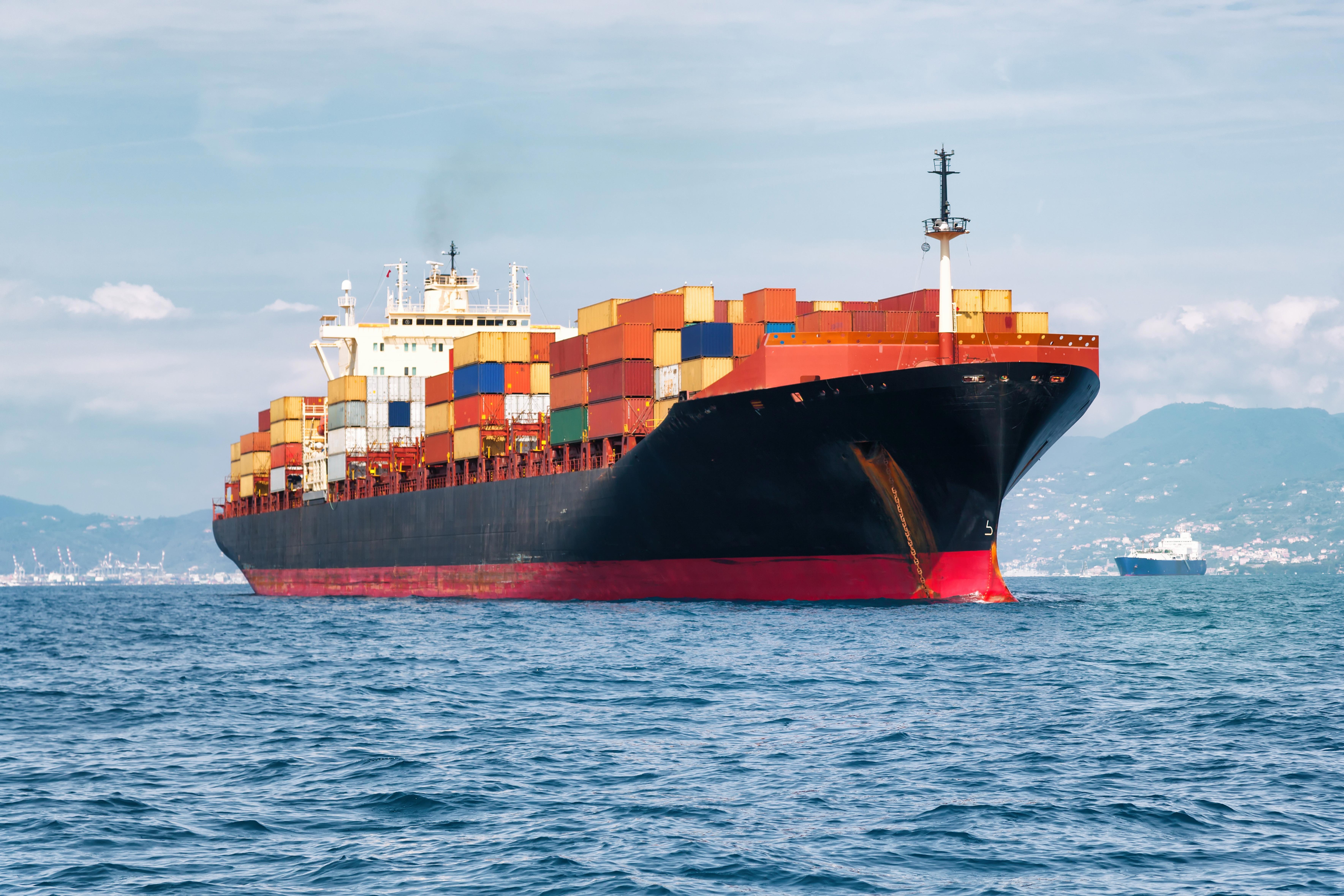 commercial-cargo-ship-carrying-containers_7075-x-4717-px-1