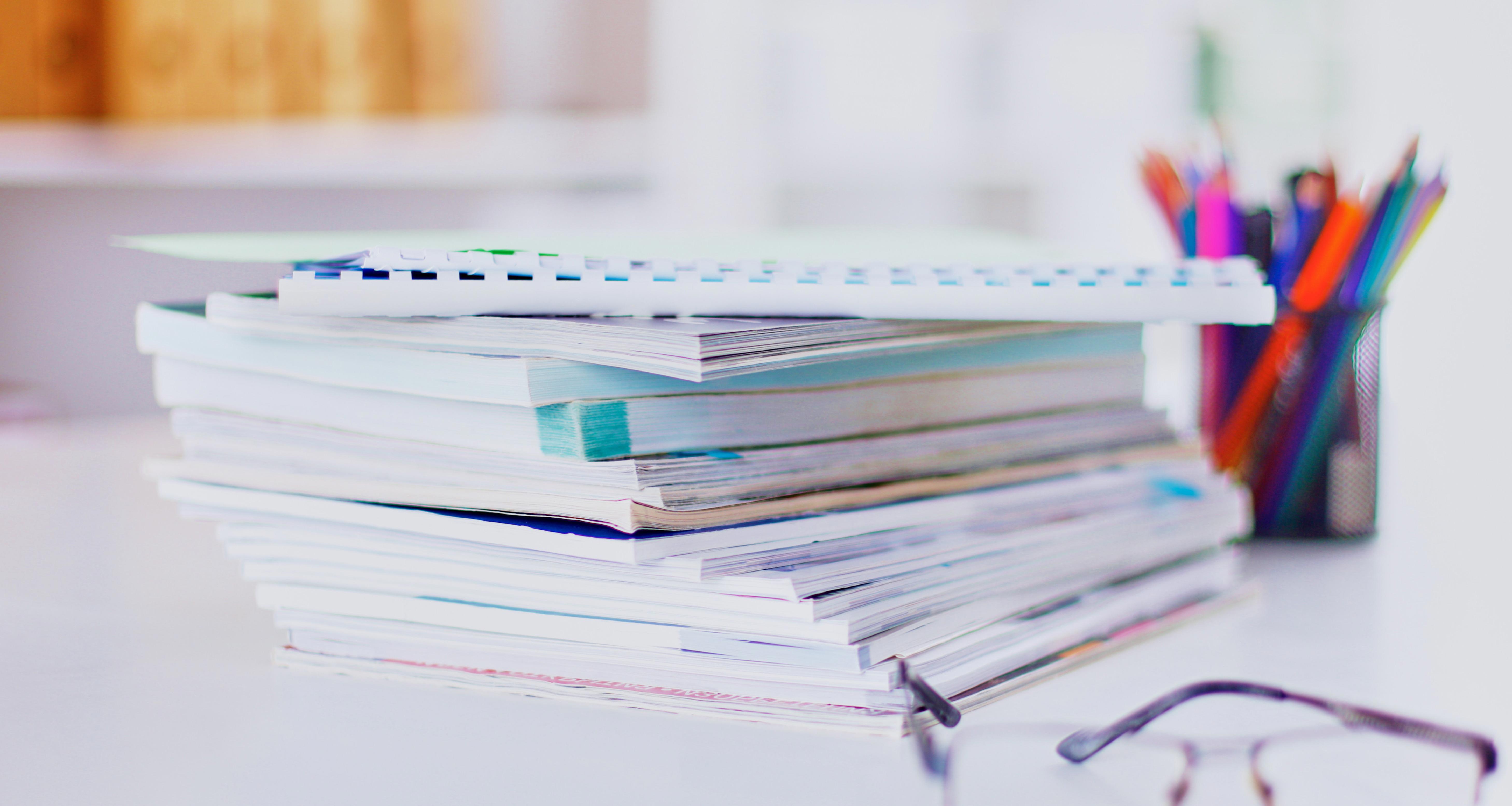 office-desk-table-with-a-lot-of-work-on-it_5833-x-3111-px