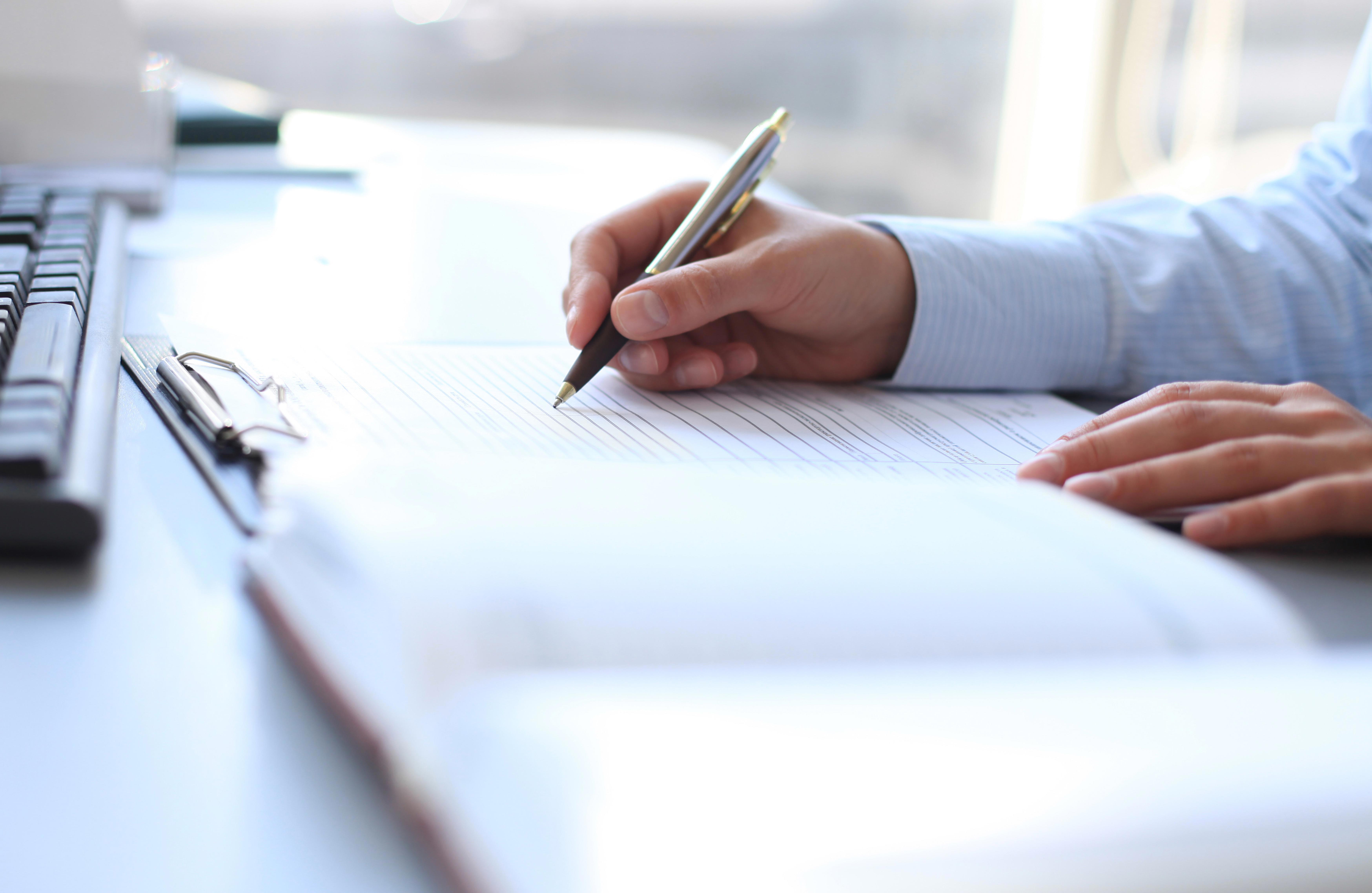 businesswoman-hands-pointing-at-business-document_6994-x-4554-px
