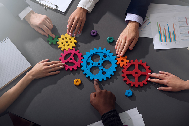 business-team-connects-gear-parts-concept-of-teamwork-partnership-and-integration_800px