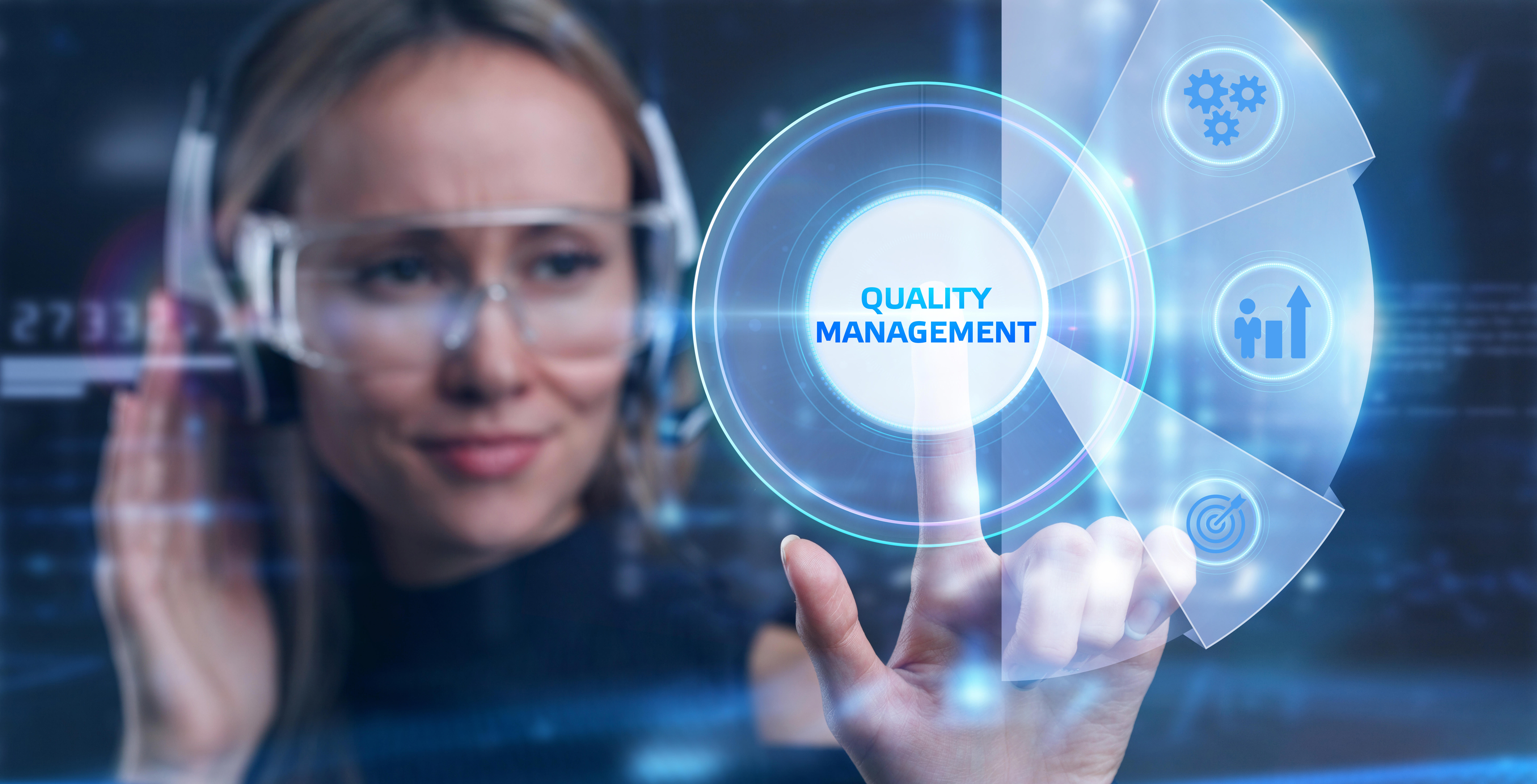 businessman-pressing-quality-management-button-on-virtual-screens-business-technology-internet-and-network-concept_9384-x-4788-px