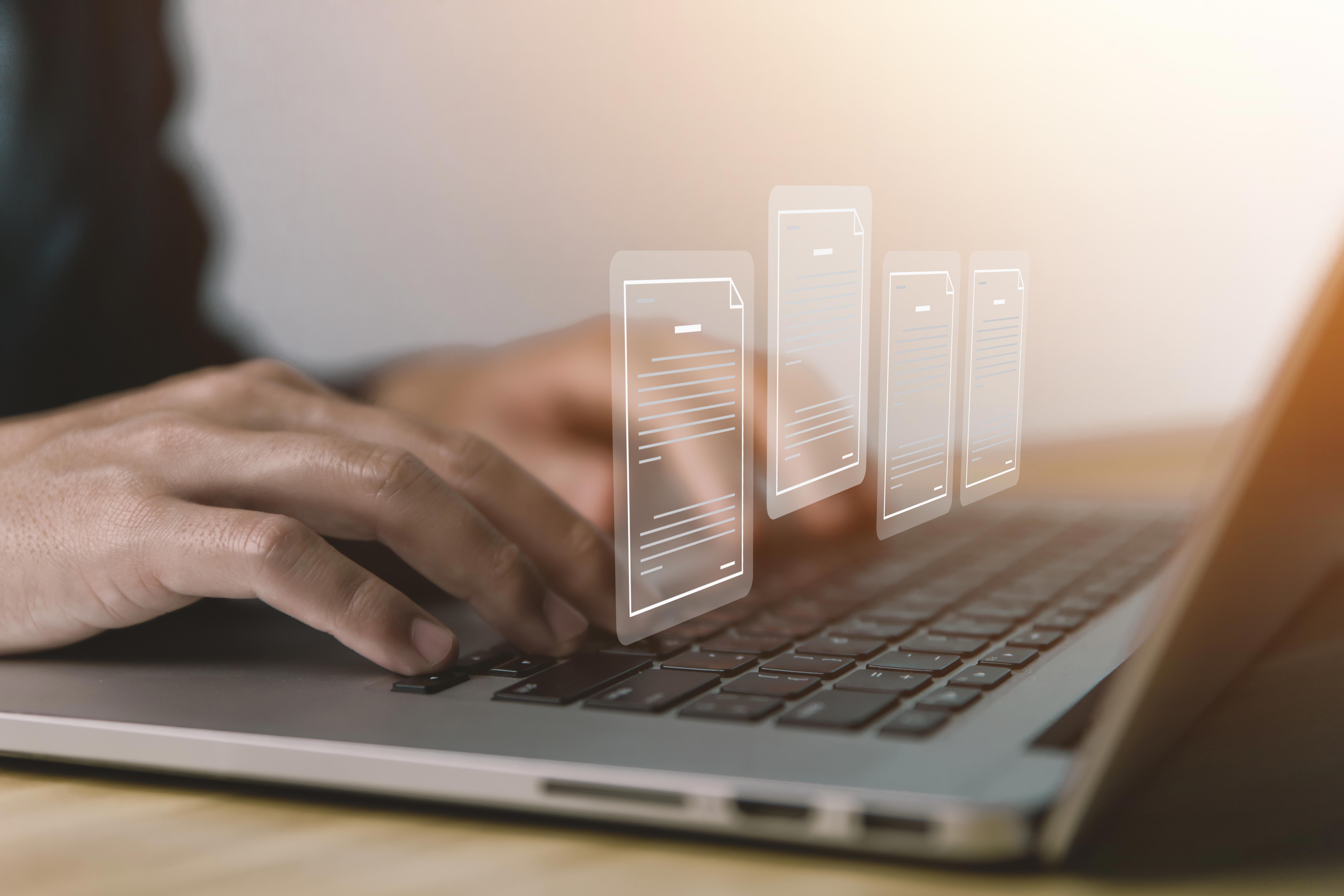businessman-hand-using-laptop-computer-with-mobile-phone-icon-on-screen_9360-x-6240-px
