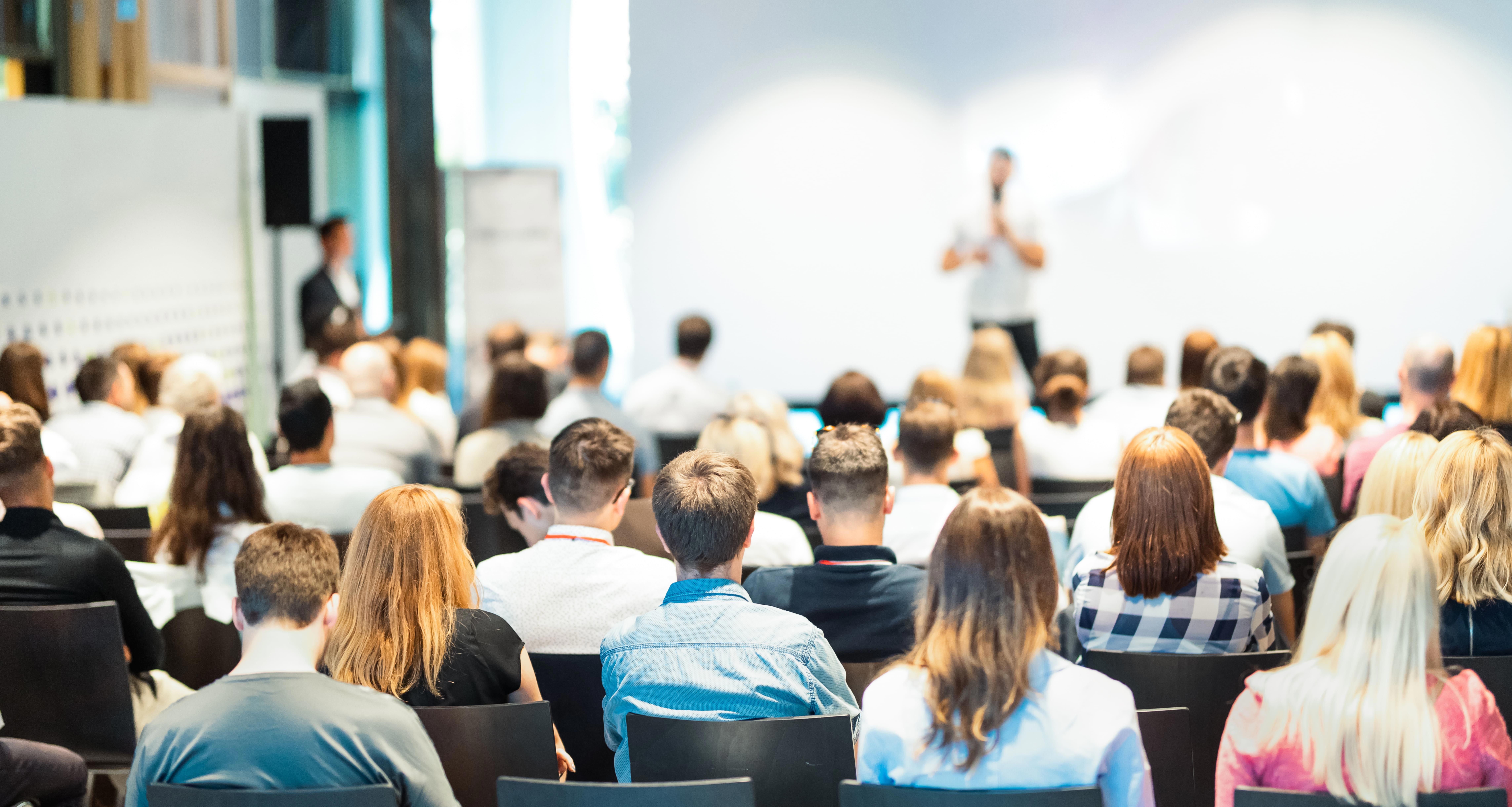 business-speaker-giving-a-talk-at-business-conference-event_9145-x-4884px-1