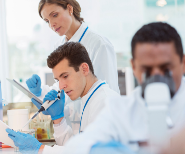 scientist-pipetting-sample-in-laboratory