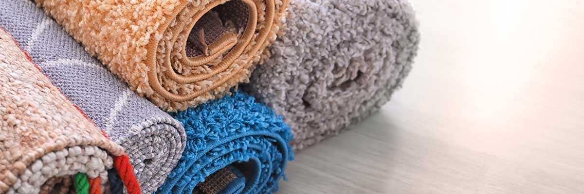 rolled-colorful-carpets-on-floor