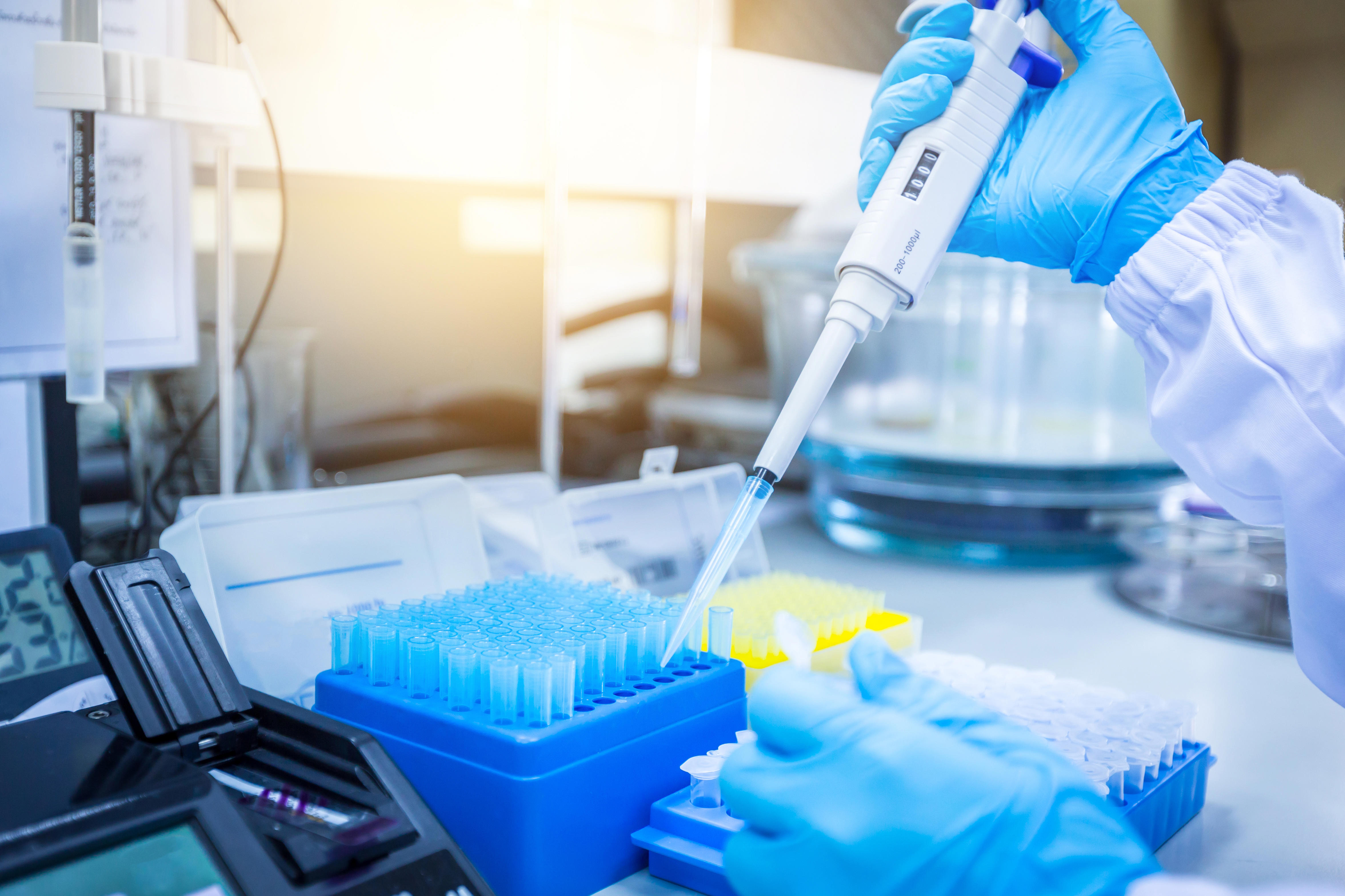 instruments-and-scientific-equipment-scientists-are-using-a-micropipette-to-suck-the-solution-for-scientific-experiments