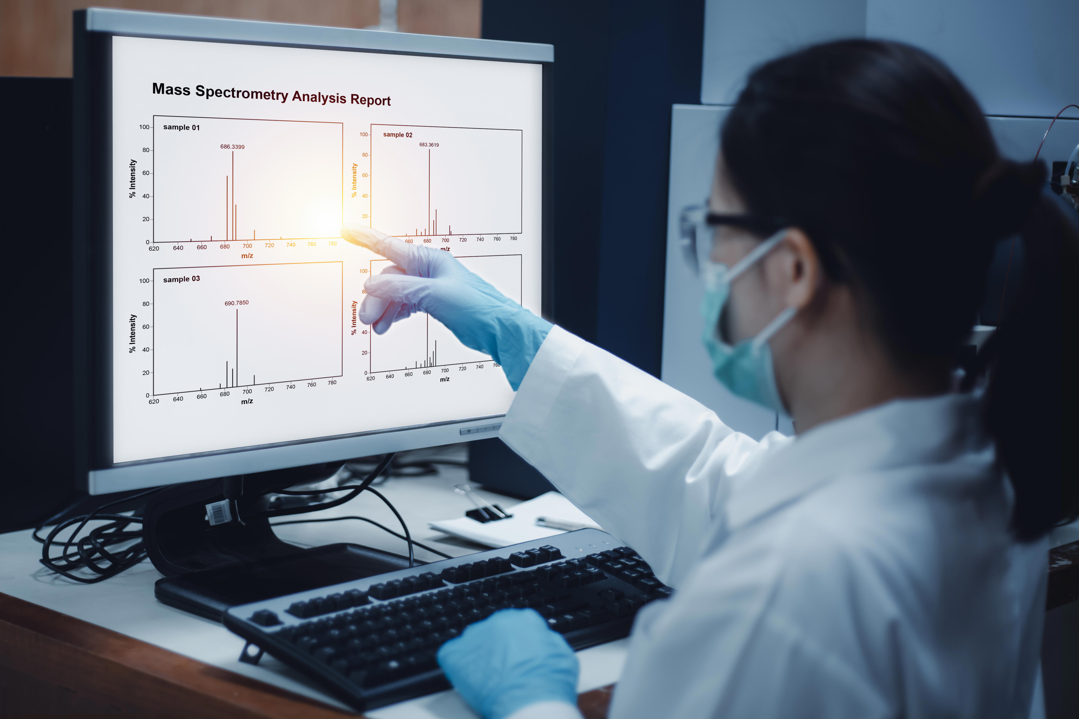 scientist-woman-indicated-mass-spectrometry-results-from-analysis-differences-of-samples-shown-on-the-computer-in-the-laboratory