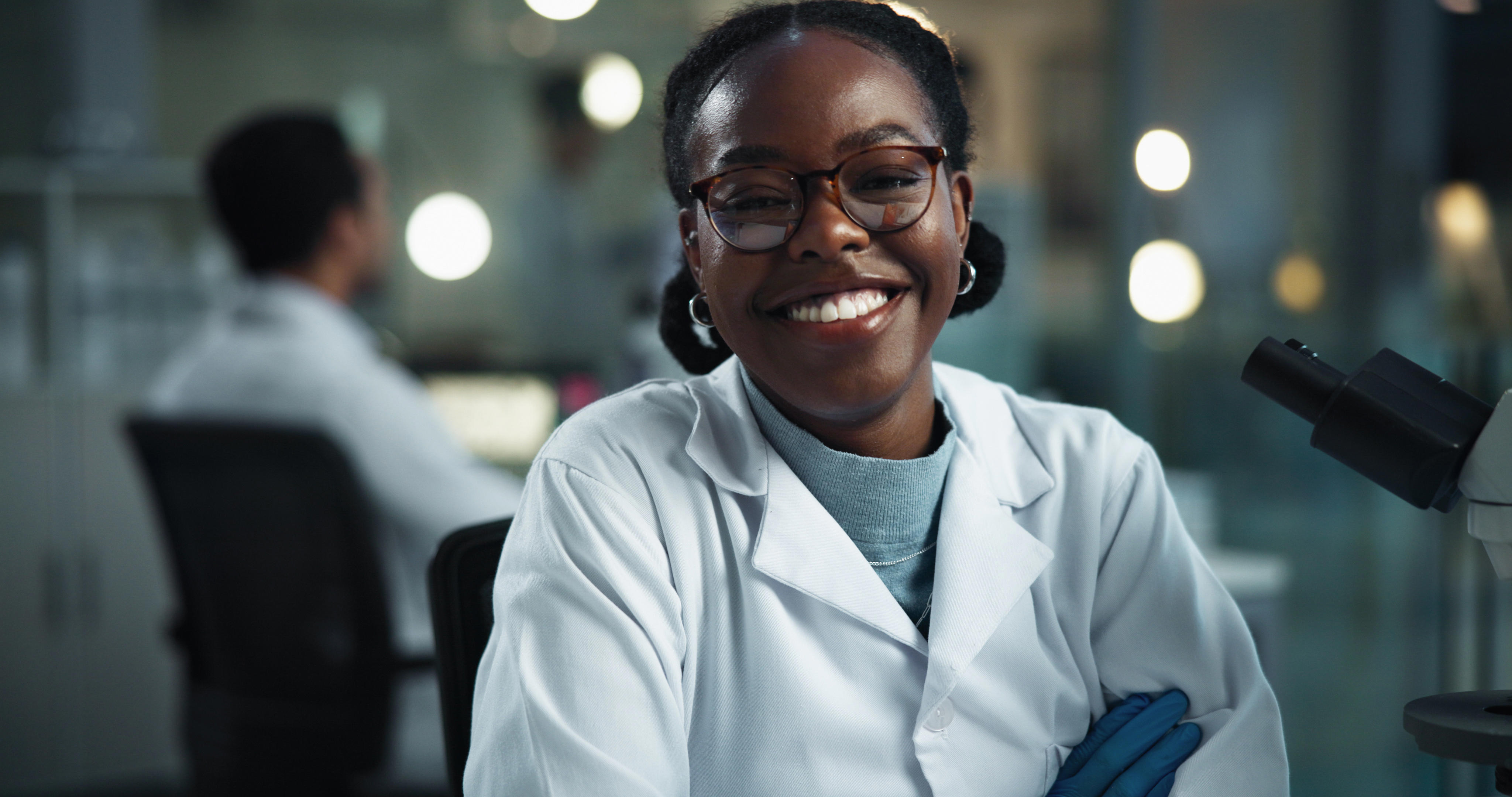 woman-scientist-and-lab-portrait-at-night-with-smile-science-research-and-medical-study-happy-scientific-pride-and-healthcare-professional-with-confidence